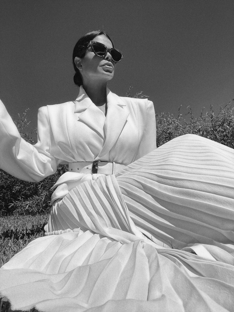 Fashion Influencer Victoria Barbara wearing Givenchy belt and Gia Studios White Blazer & Skirt
