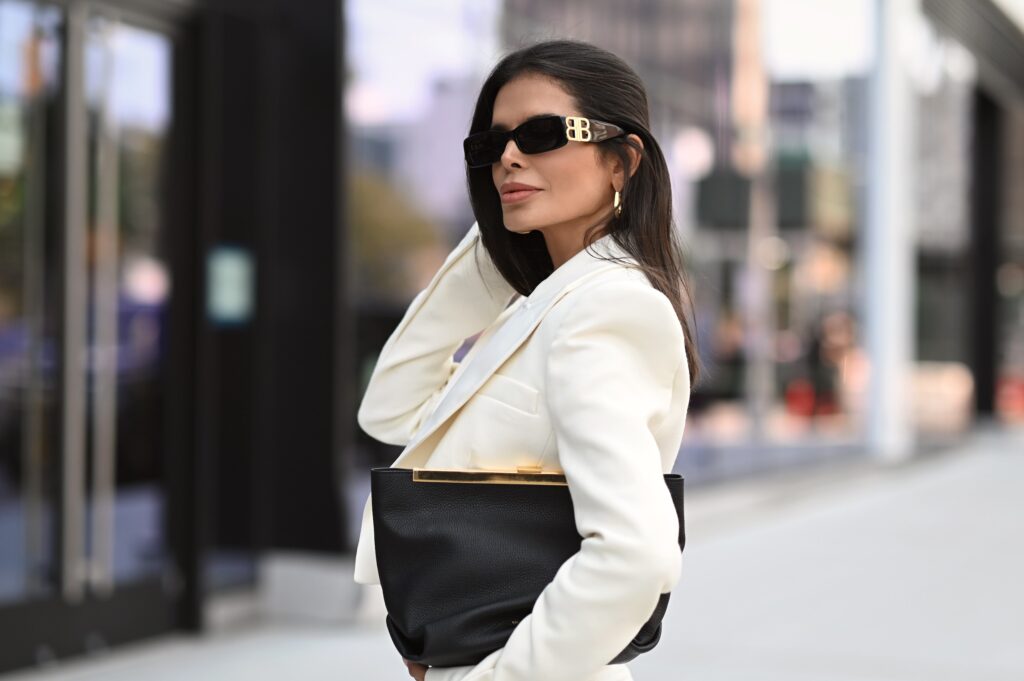 Victoria Barbara wearing KHAITE white dress & blazer at New York Fashion Week 2021 street style