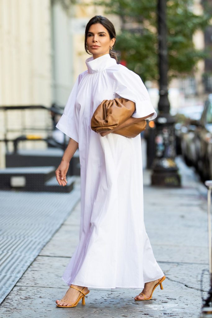 Victoria Barbara NYC Street Style holding Bottega Veneta Pouch