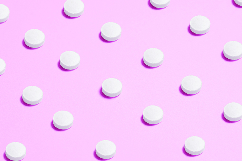 Pink background with pills