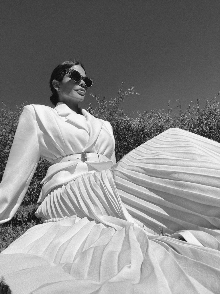 Fashion Influencer Victoria Barbara wearing Givenchy belt and Gia Studios White Blazer & Skirt