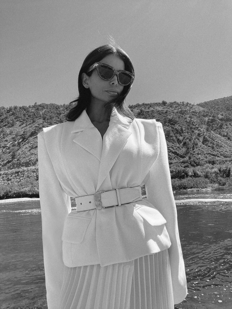 Fashion Influencer Victoria Barbara wearing Givenchy belt and Gia Studios White Blazer & Skirt