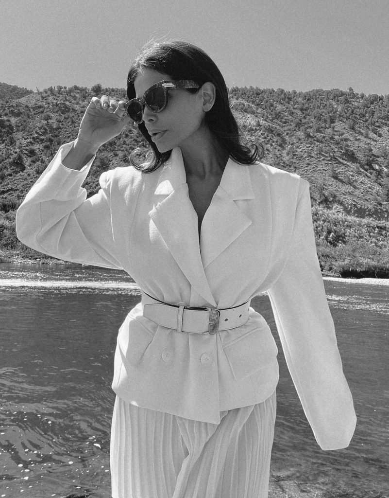 Fashion Influencer Victoria Barbara wearing Givenchy belt and Gia Studios White Blazer & Skirt