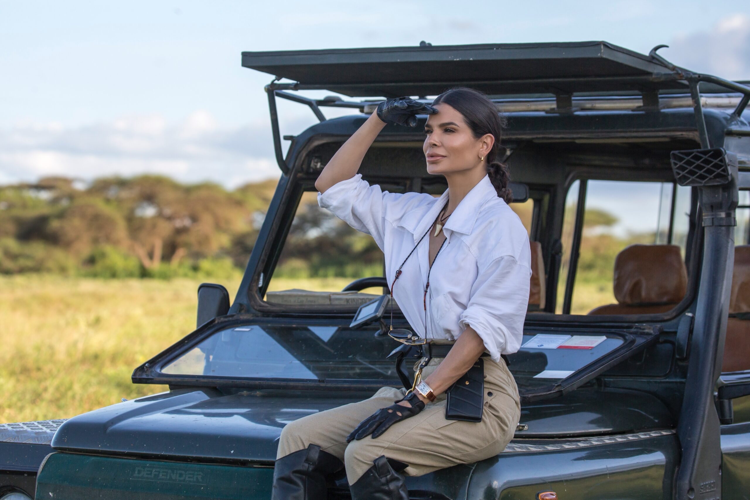 Kenya safari sunrise landscape with acacia trees and soft morning light