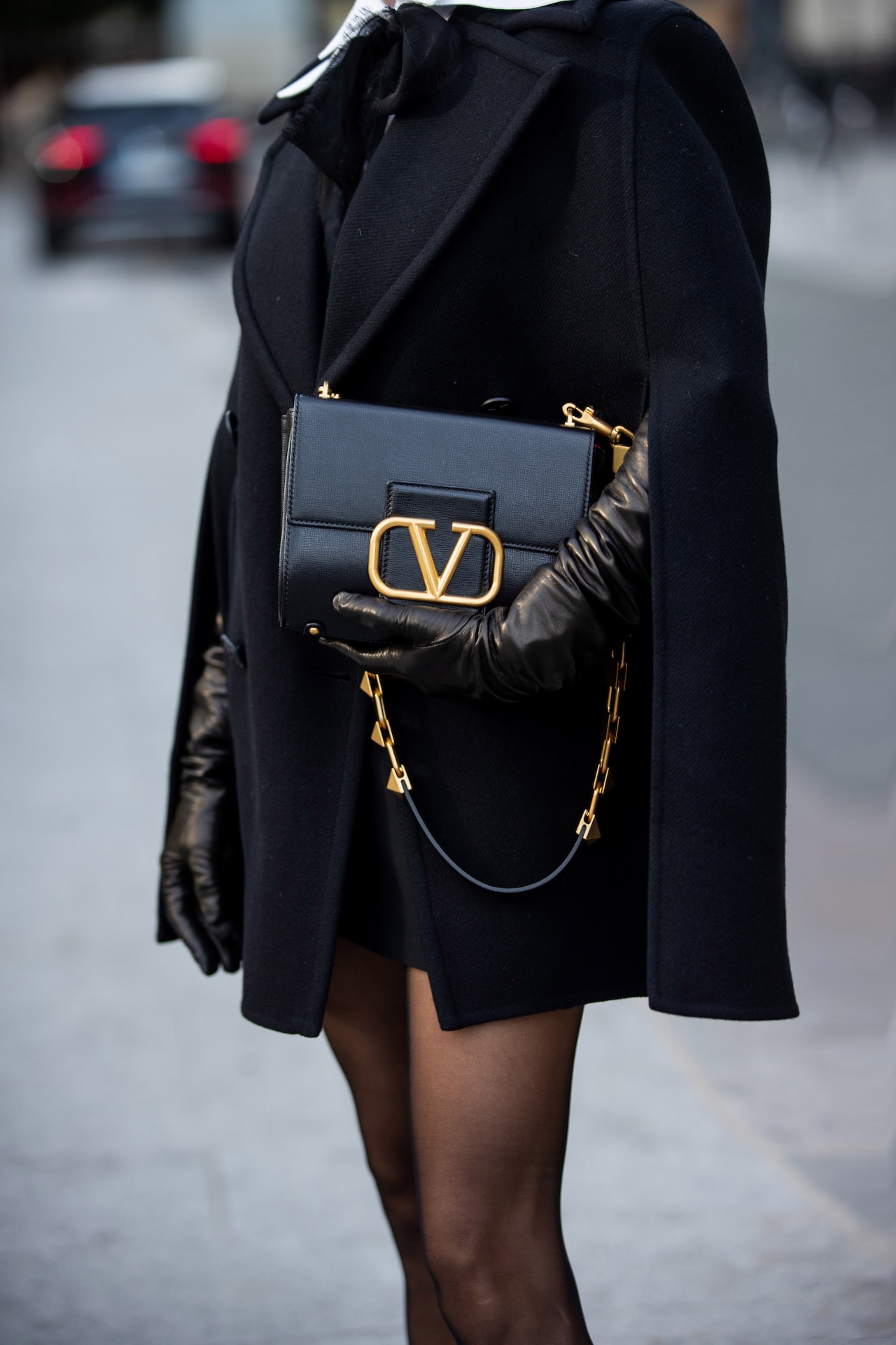 Victoria Barbara in Valentino cape look with white collar and black bow detail Paris Fashion Week