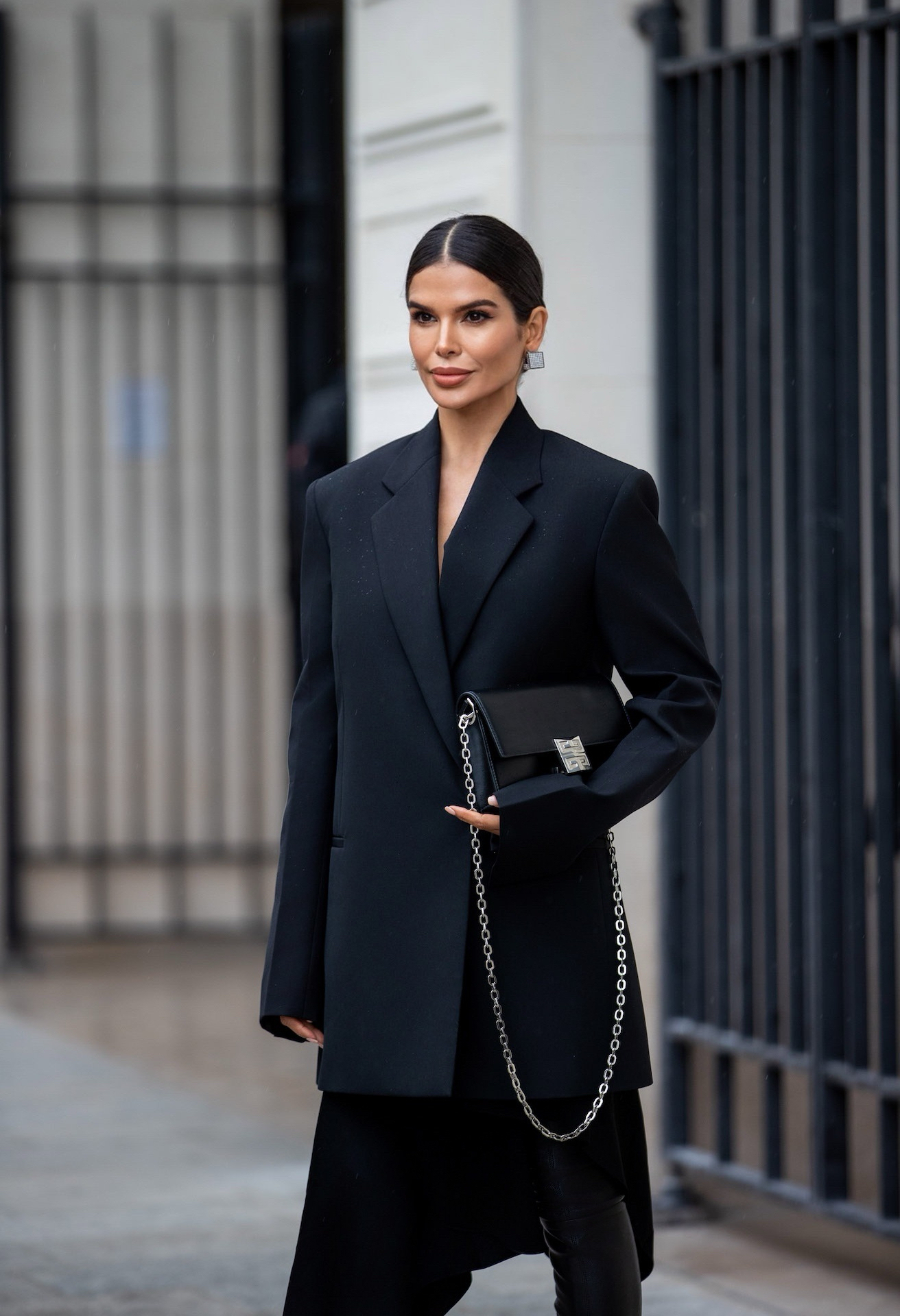 Victoria Barbara in motion on a Paris street wearing Givenchy blazer and skirt during Fashion Week