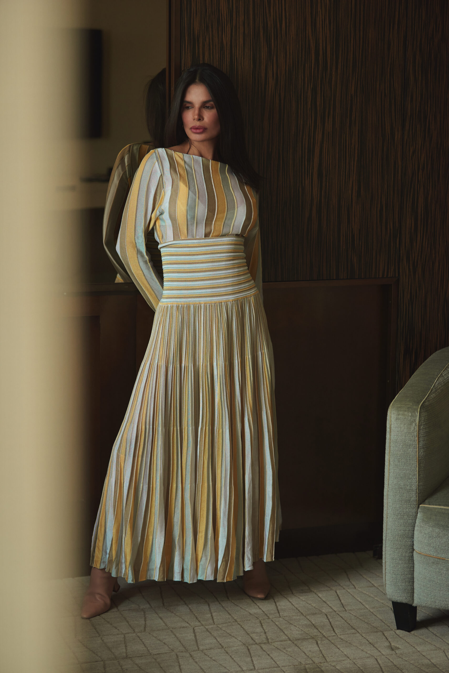Full-length Bevza look featuring striped pleated dress with defined waist and clean vertical lines