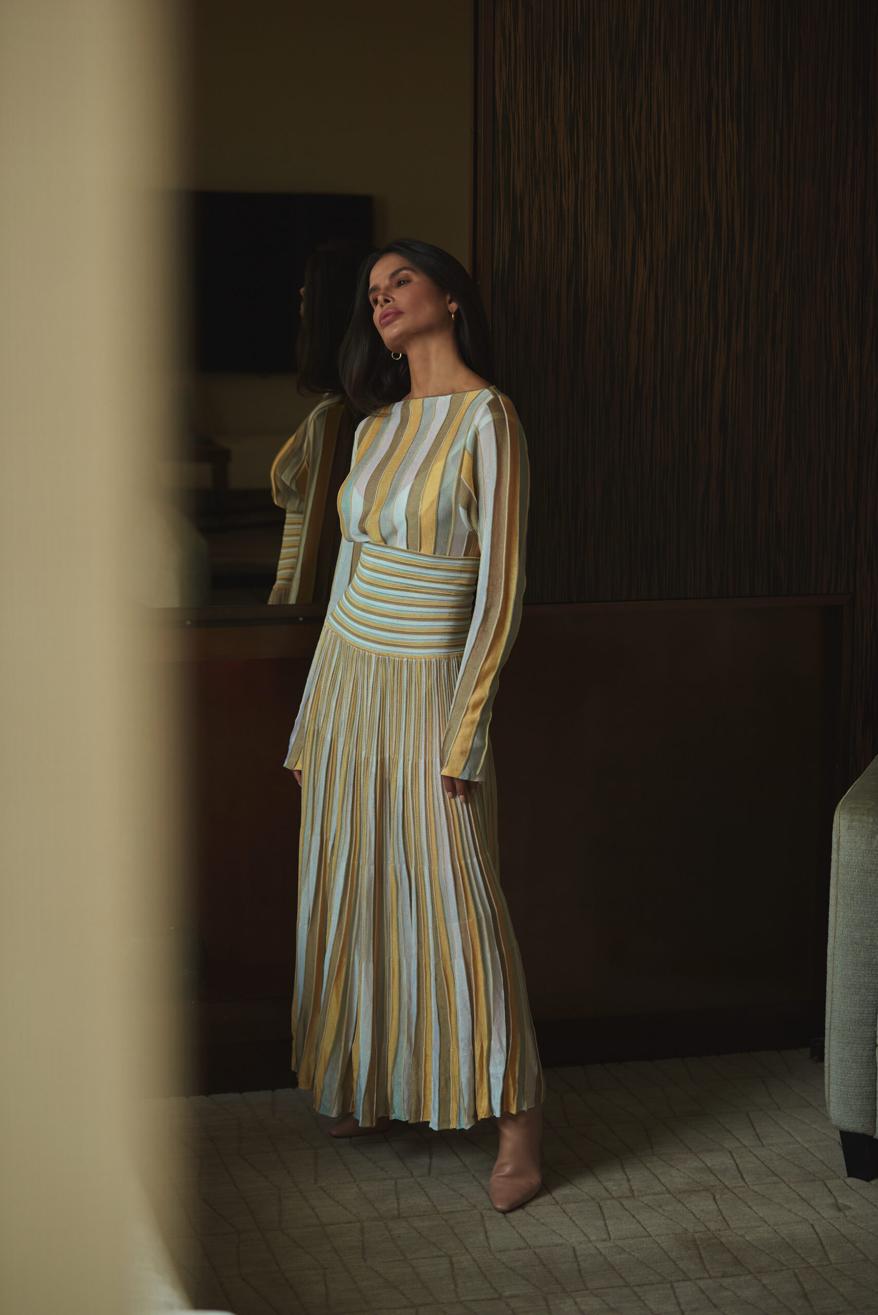 Bevza dress reflected in mirror with soft interior lighting and neutral composition