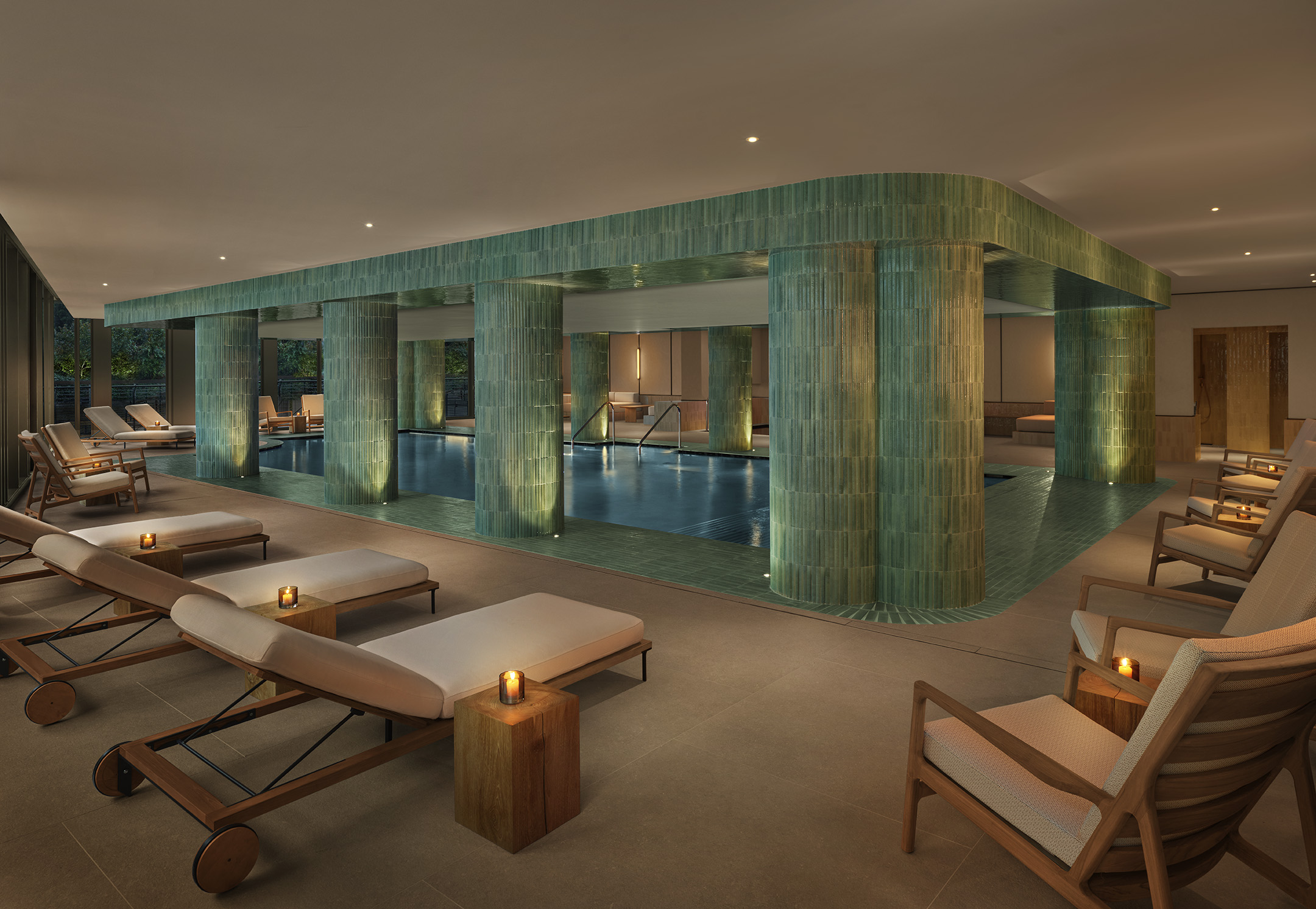 Spa relaxation pool at The Lake Como EDITION with stone walls and calm water