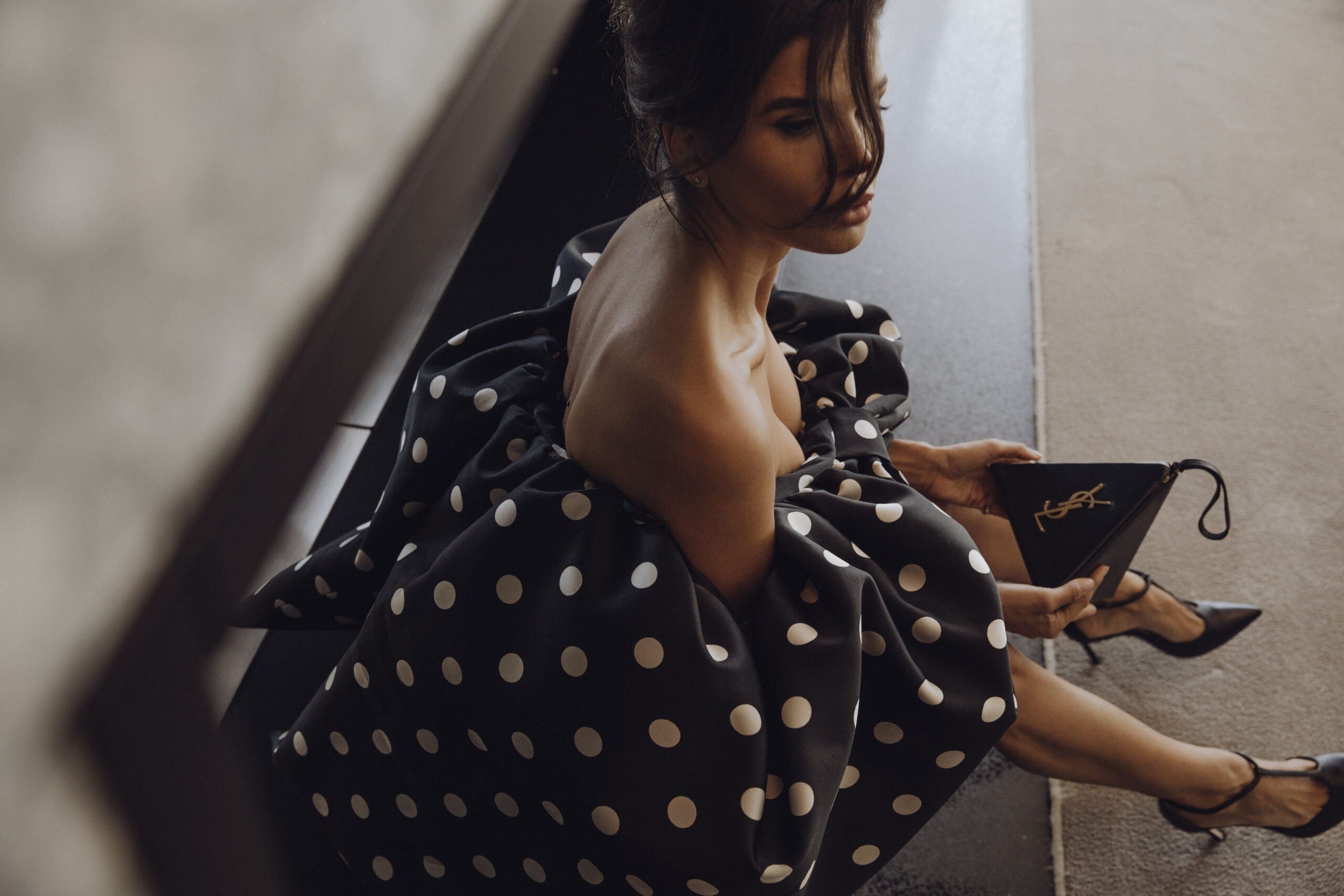 Givenchy dress with polka dot pattern viewed from staircase perspective showing movement