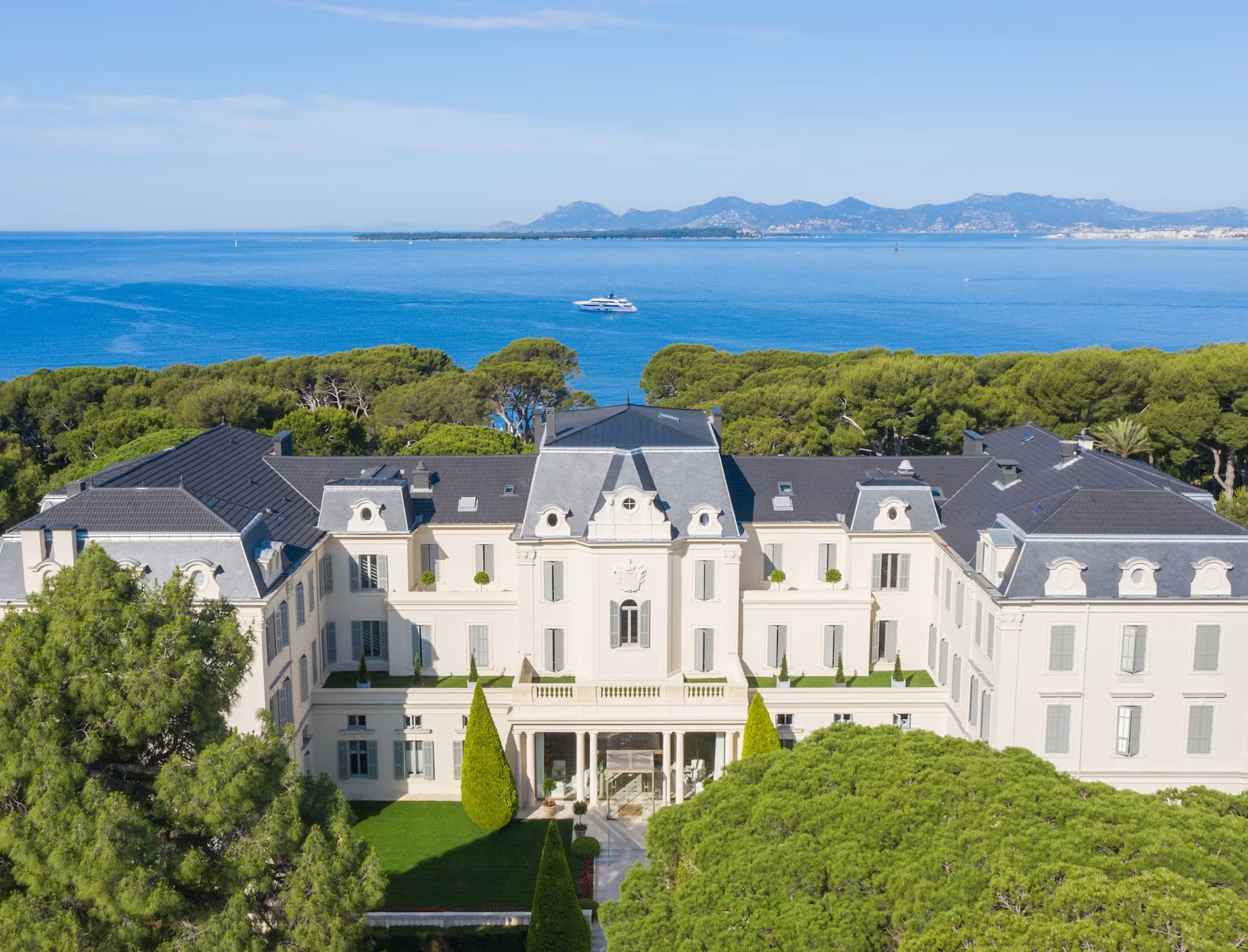 Hotel du Cap-Eden-Roc exterior with palm trees and grand entrance in Cap d'Antibes France