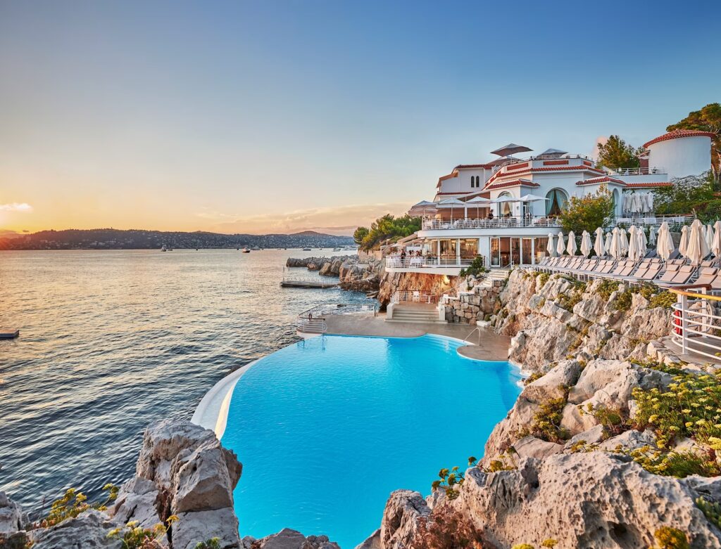 Sunset view over the French Riviera from Hotel du Cap Eden Roc with sea and lights