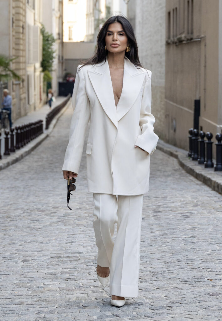 Victoria Barbara wearing a white Givenchy tailored suit walking in Paris during Haute Couture