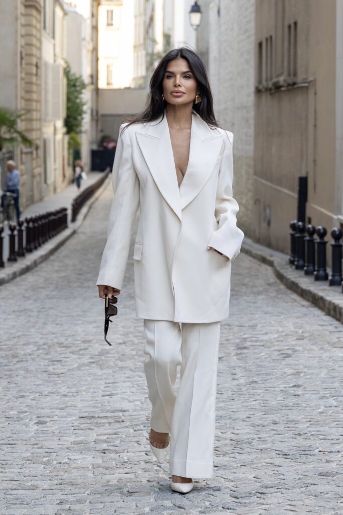 Victoria Barbara wearing a white Givenchy tailored suit walking in Paris during Haute Couture