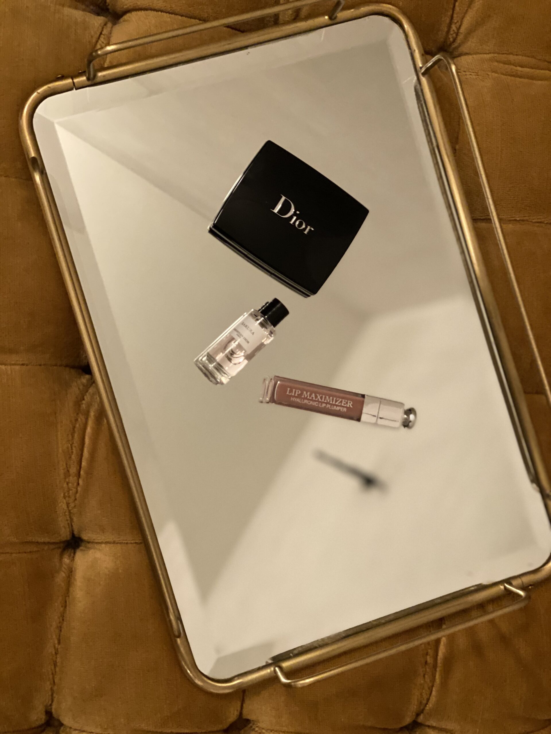 Dior beauty products arranged on mirrored tray in Soho House New York room