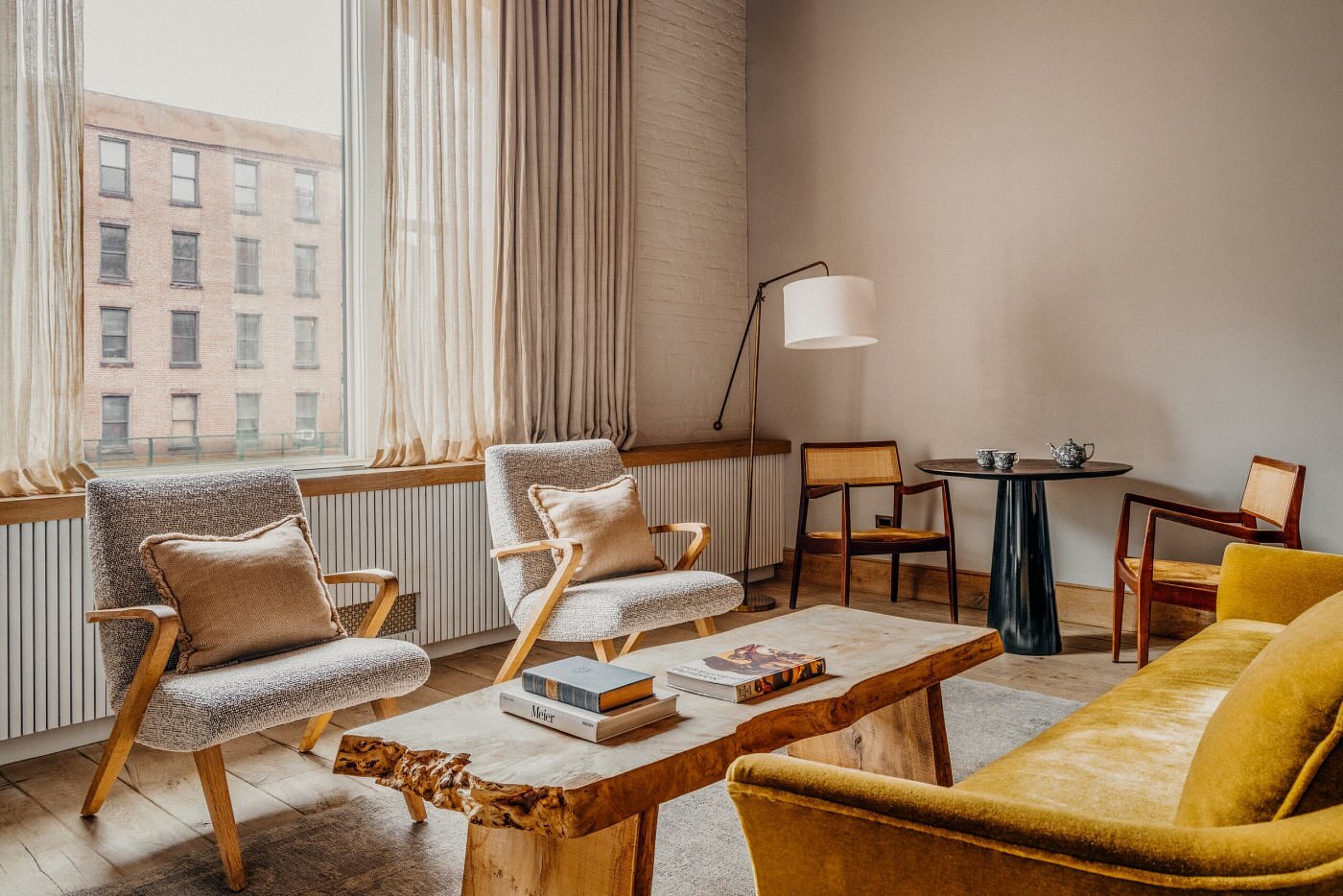 Soho House New York living room interior with sofas and warm lighting