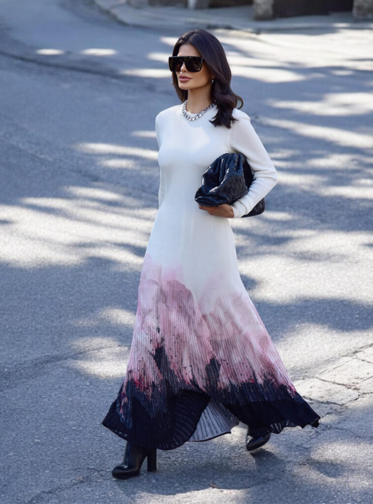Victoria Barbara wearing Alexander McQueen dress styled with Givenchy sunglasses and woven Bottega Veneta clutch