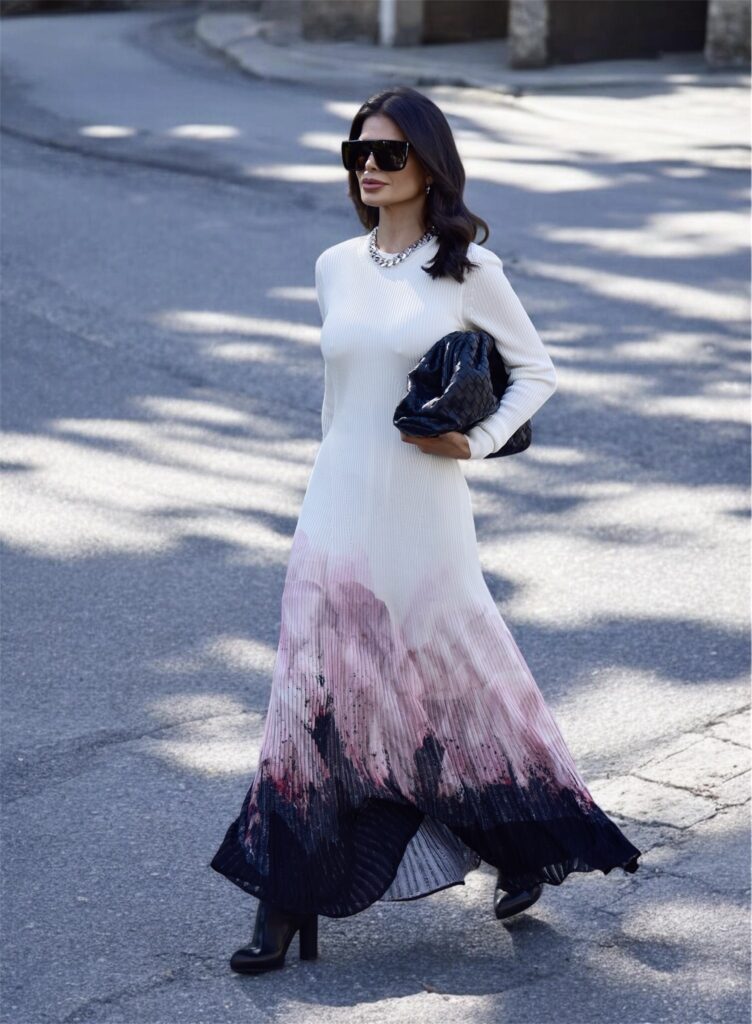 Victoria Barbara wearing Alexander McQueen dress styled with Givenchy sunglasses and woven Bottega Veneta clutch