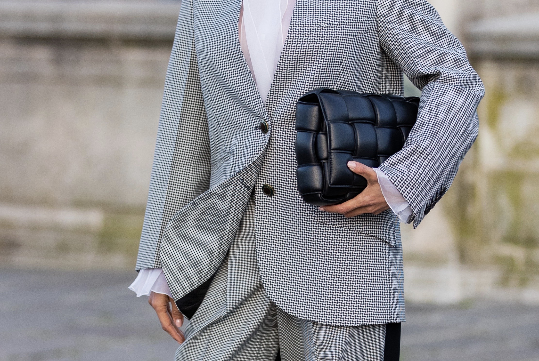 Bottega Veneta padded clutch styled with Givenchy tailored suit detail in Paris