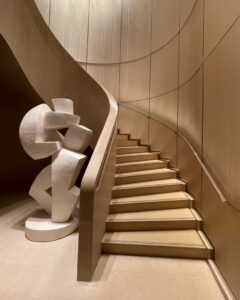 Sculptural staircase inside Cheval Blanc Paris with curved architectural design