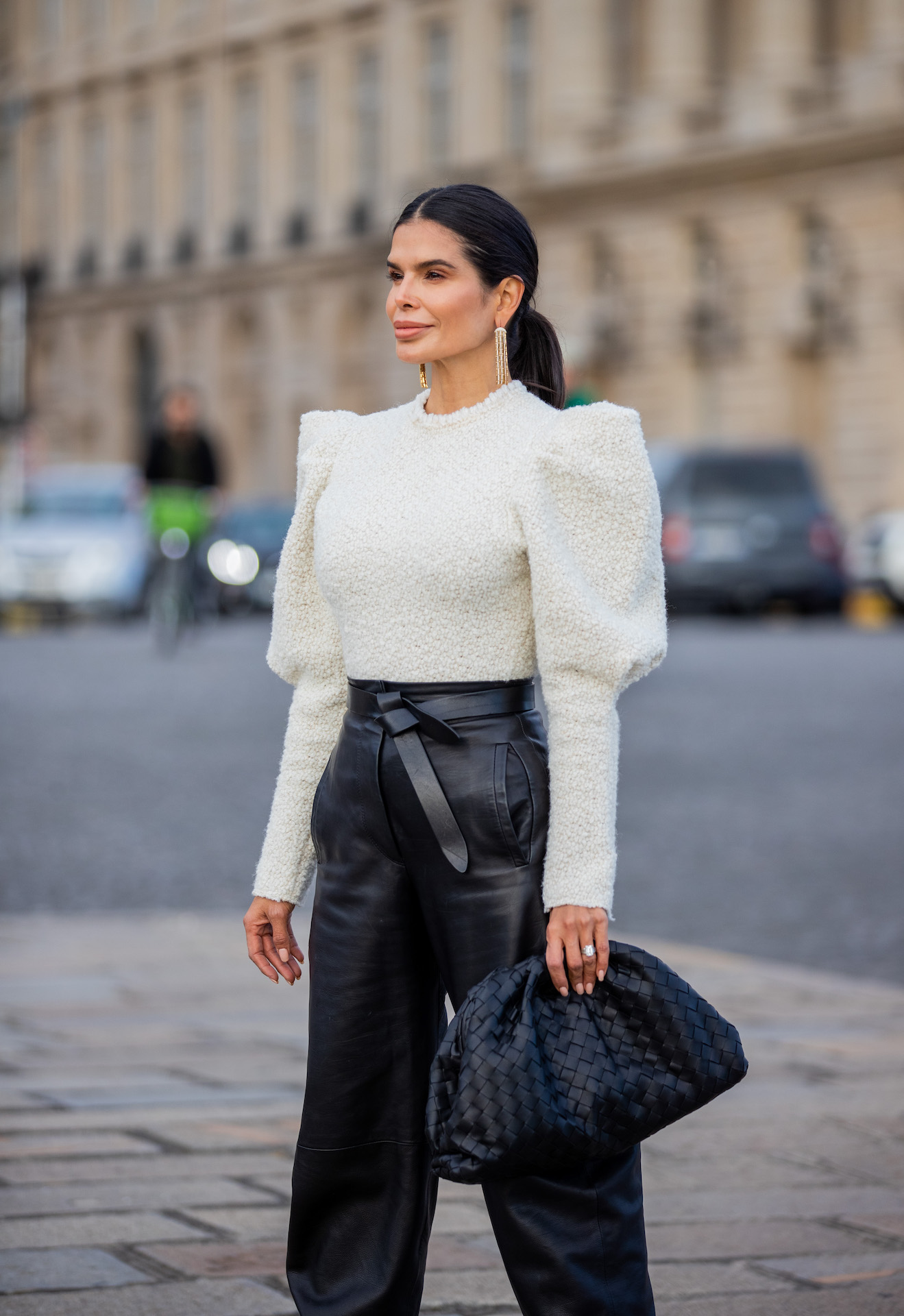 Victoria Barbara in Isabel Marant textured top with structured shoulders and black leather trousers in Paris