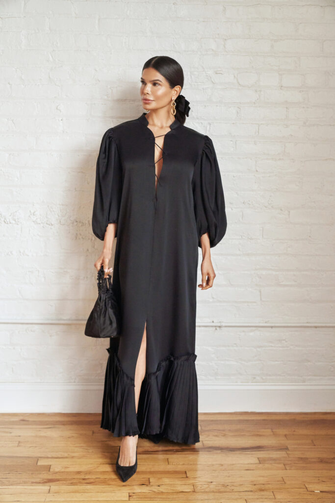 Victoria Barbara wearing a black Khaite dress with structured silhouette in a minimal editorial setting