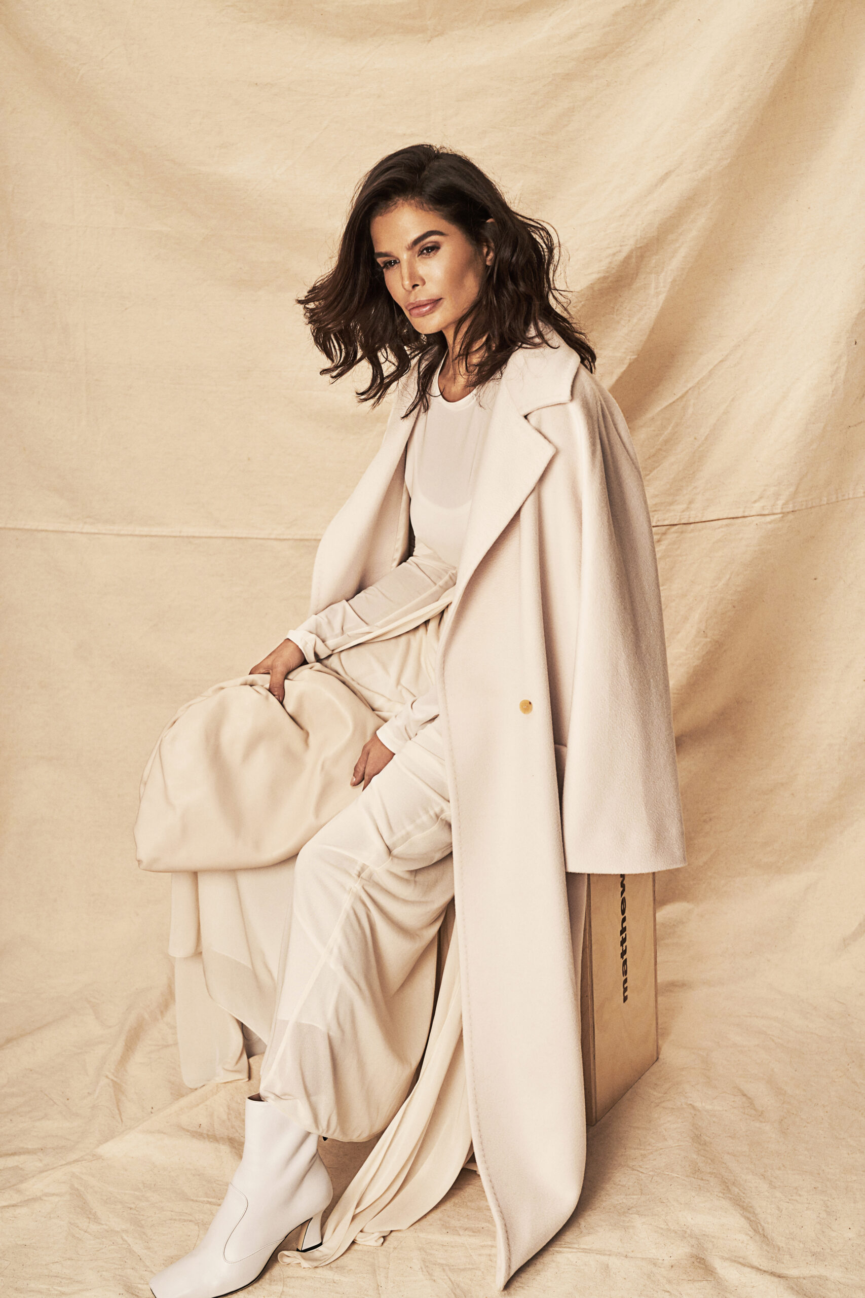 Victoria Barbara in a neutral Max Mara editorial look highlighting long coat silhouette and monochrome styling