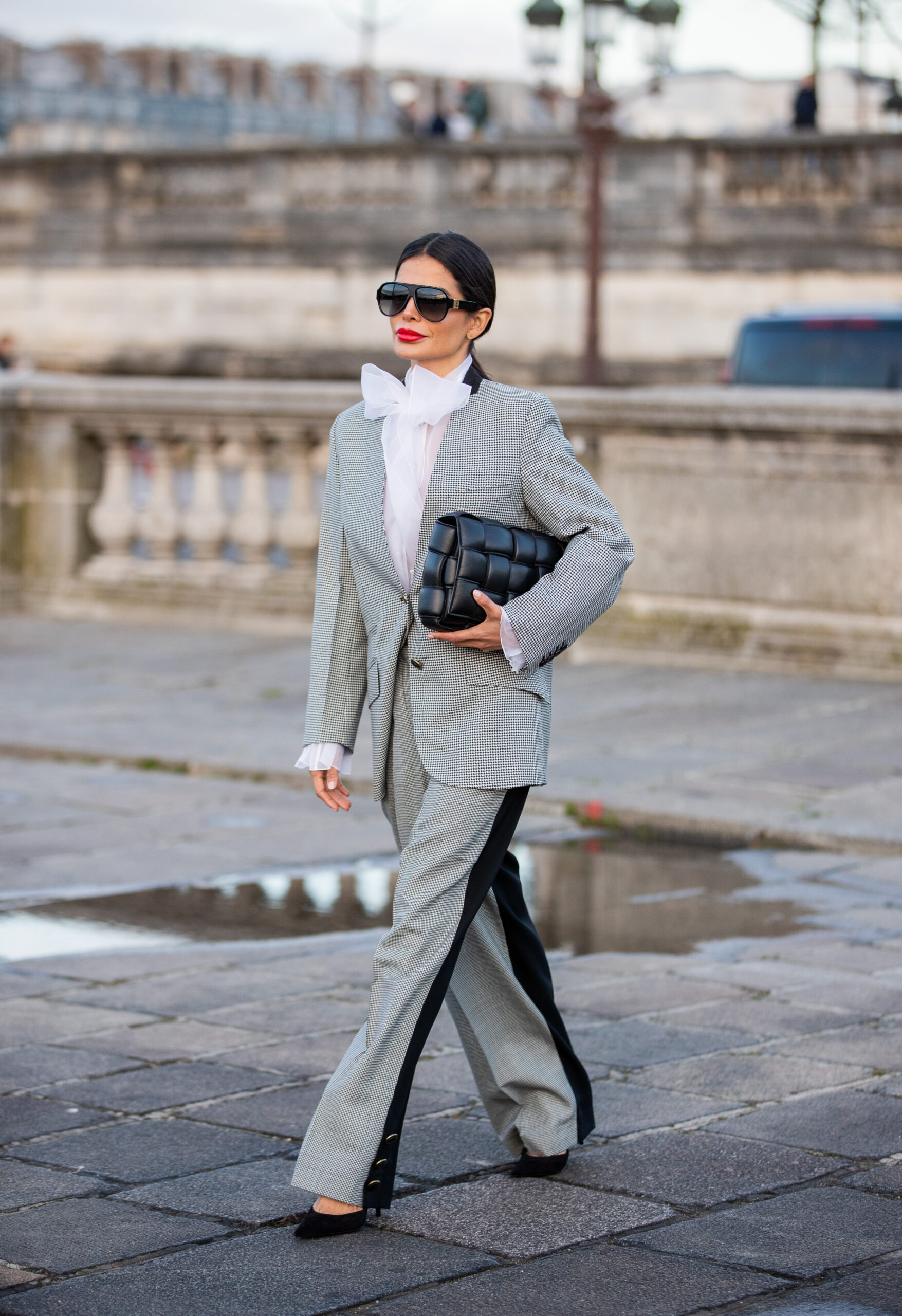 Victoria Barbara street style outside Givenchy show in Paris wearing tailored suit and Bottega Veneta clutch
