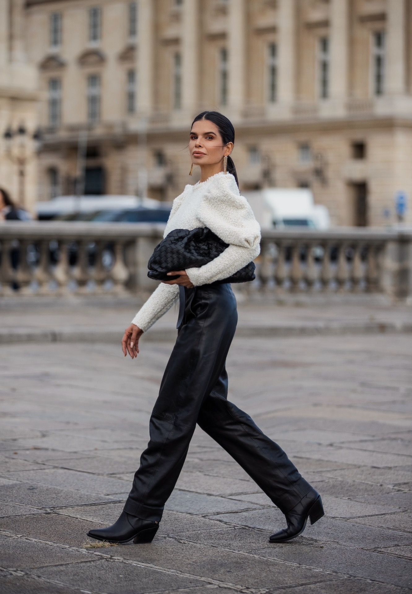 Victoria Barbara walking in Isabel Marant outfit styled with Bottega Veneta pouch during Paris Fashion Week