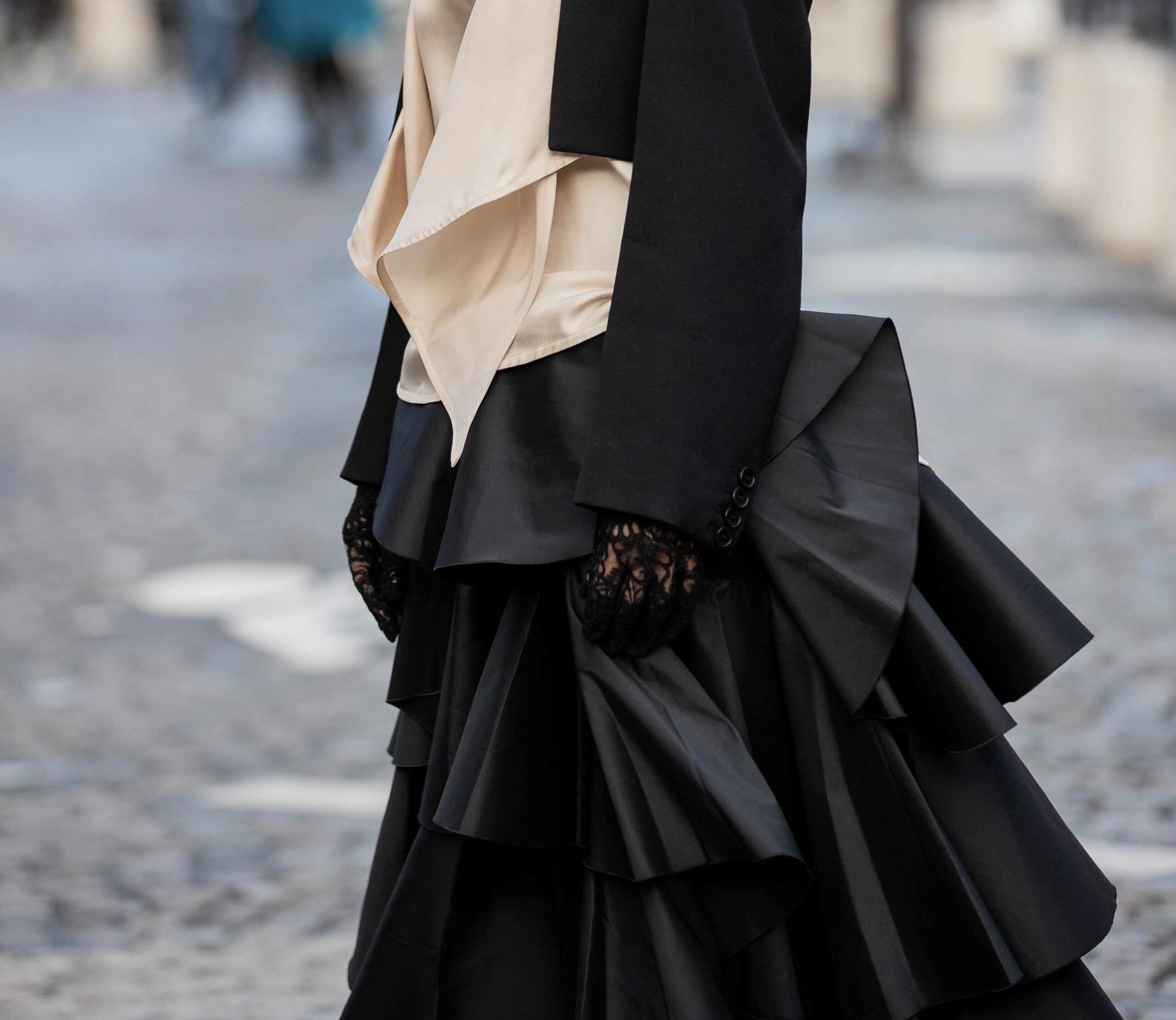 Detail of Alexander McQueen lace gloves and Giambattista Valli layered skirt photographed during Paris Fashion Week.