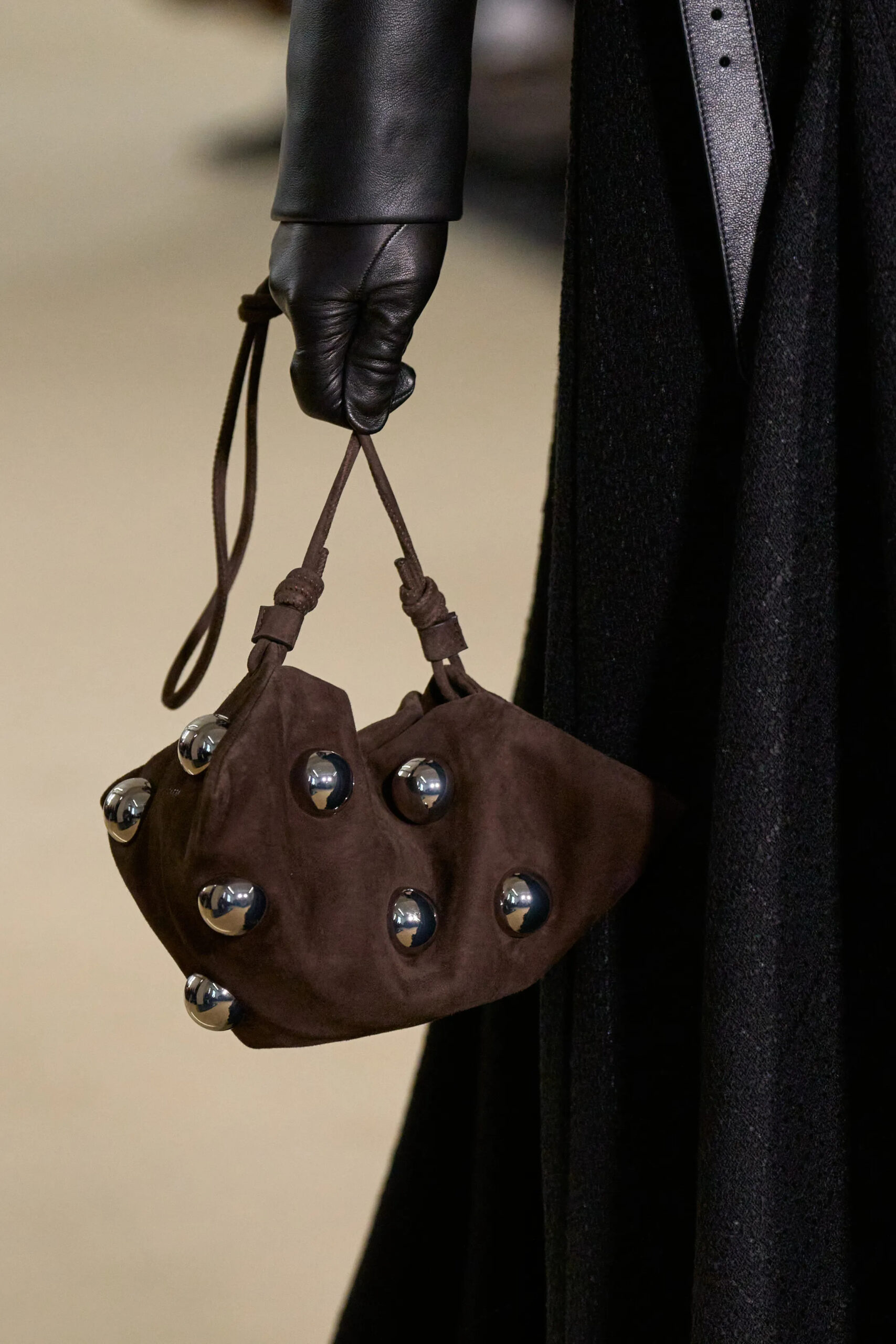 Brown suede handbag with metallic stud detailing from Altuzarra Fall Winter 2026