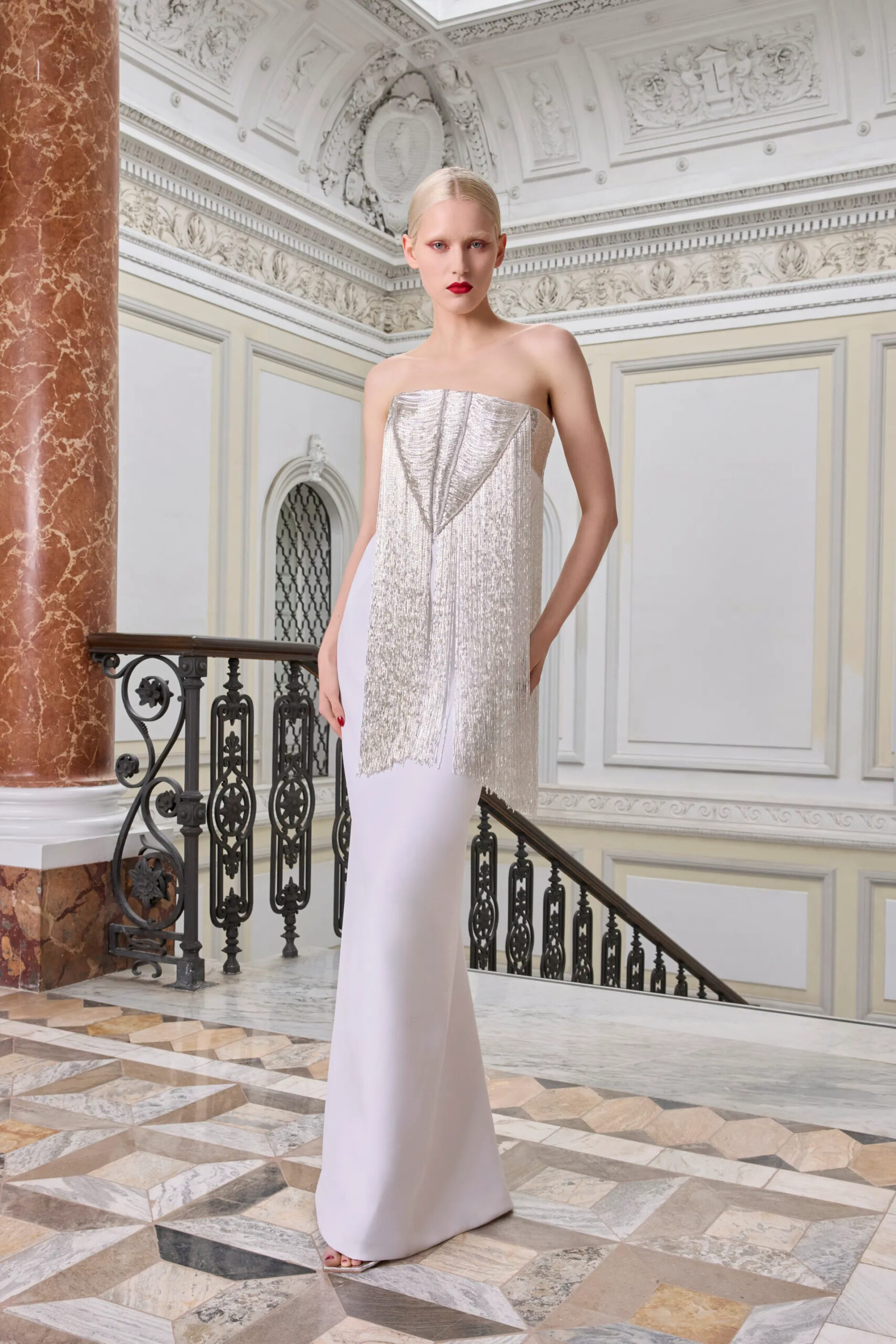 Silver embellished Antonio Grimaldi Spring 2026 Couture column gown with asymmetrical detailing