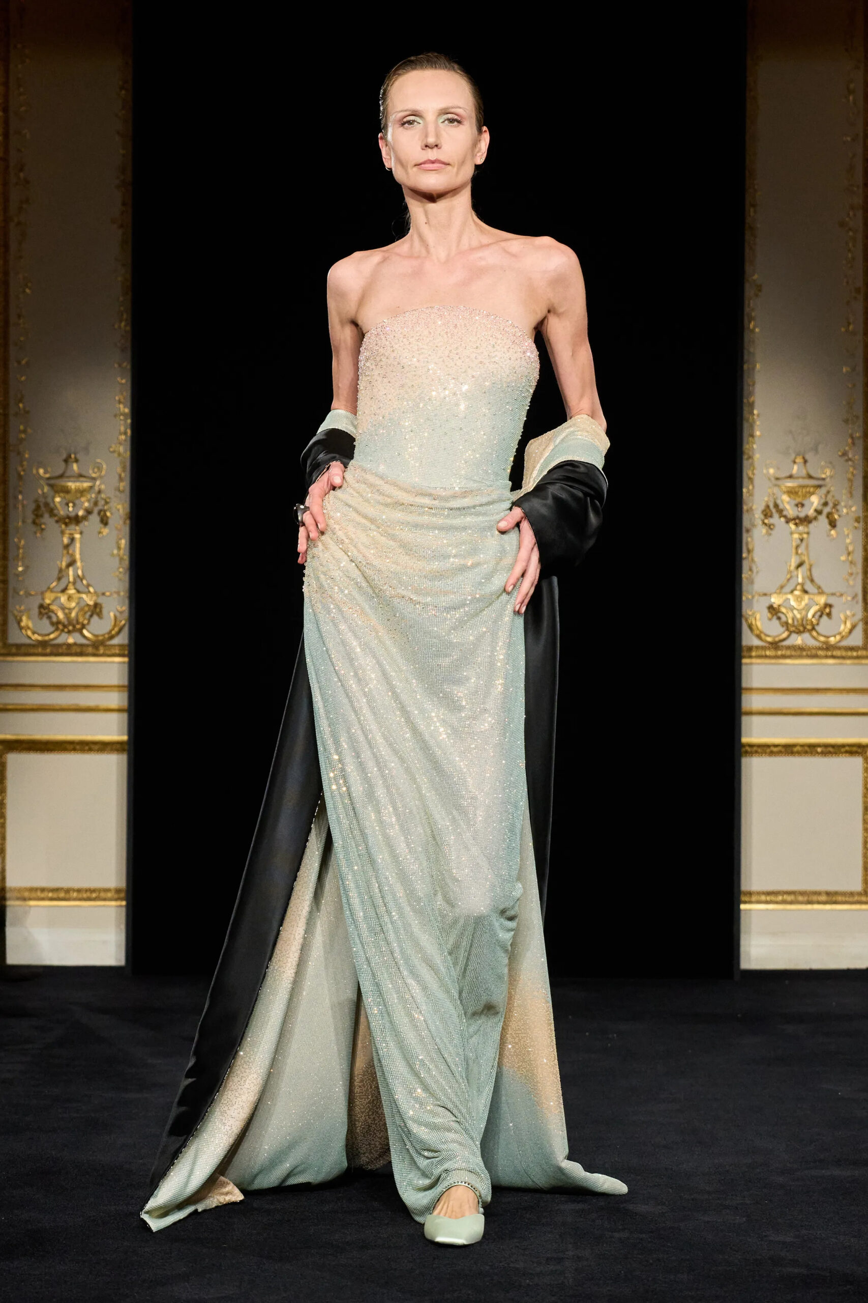 Model wearing pale mint corset and black sequined gown from Armani Privé Spring 2026 Couture