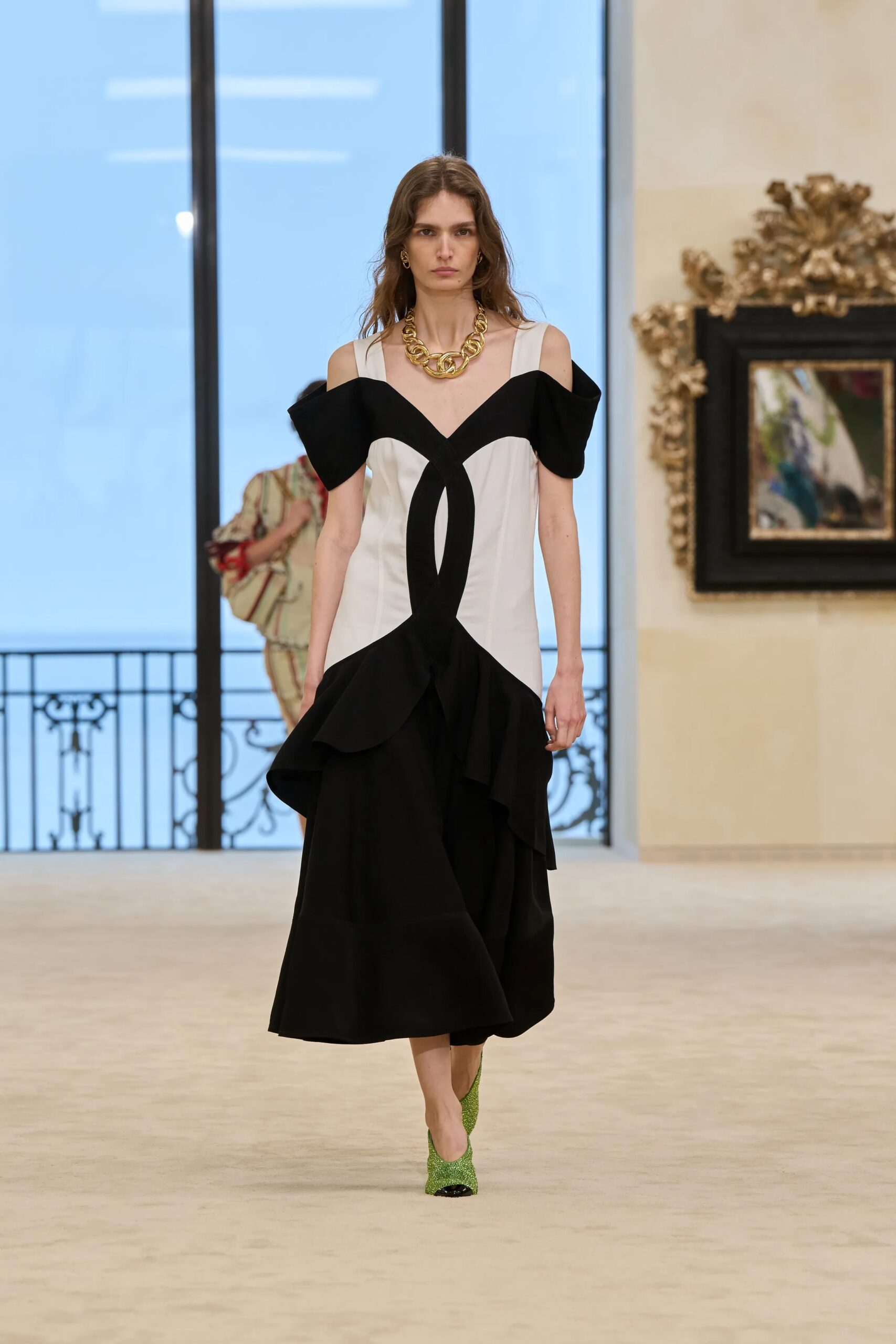 Chanel Cruise 2026/27 off shoulder black and white structured dress runway
