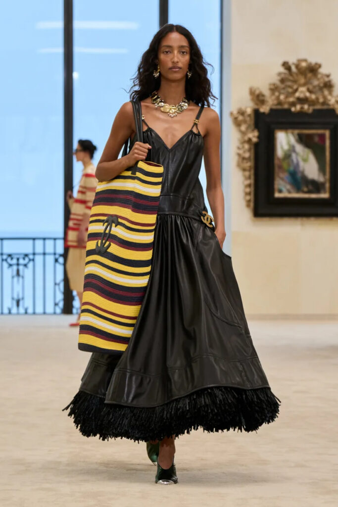 Chanel Cruise 2026/27 black leather dress striped tote bag runway look