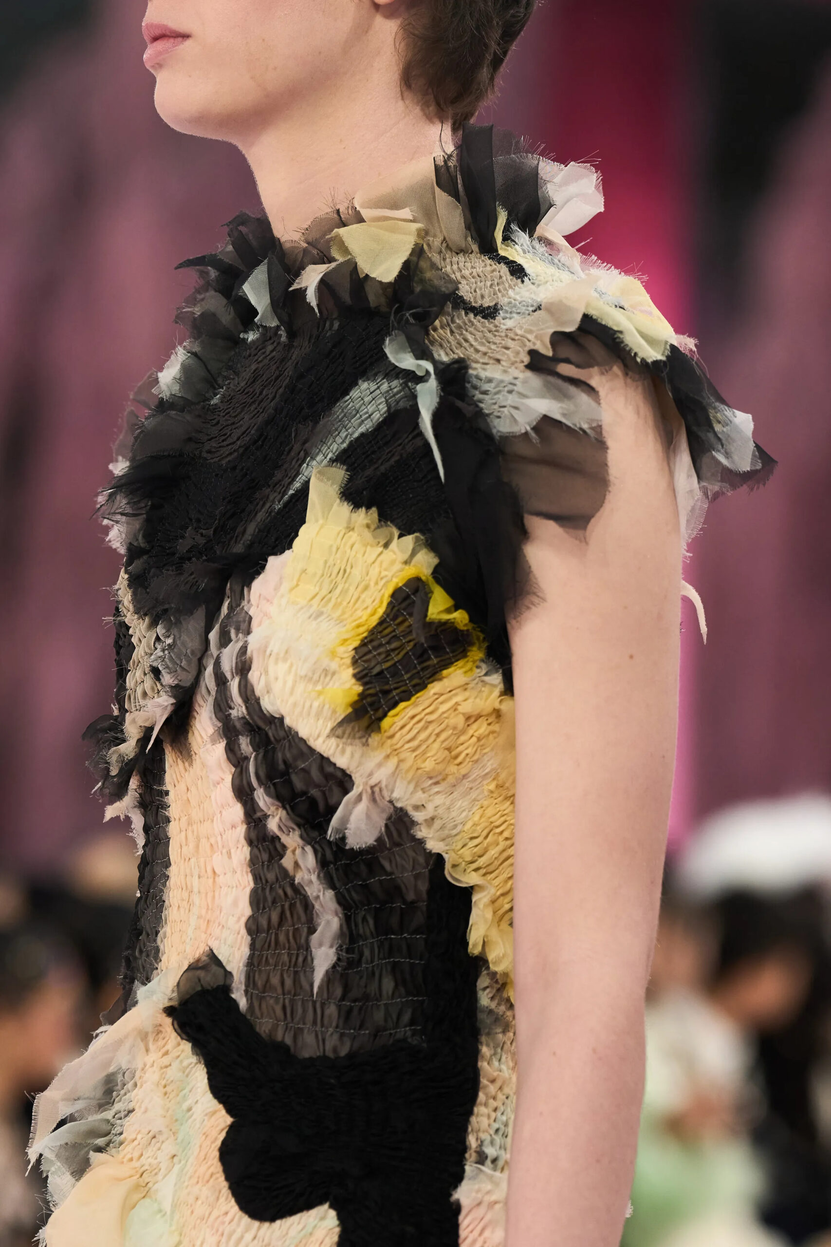 Close-up of layered black, cream, and yellow textile construction on a Chanel Spring 2026 Couture garment