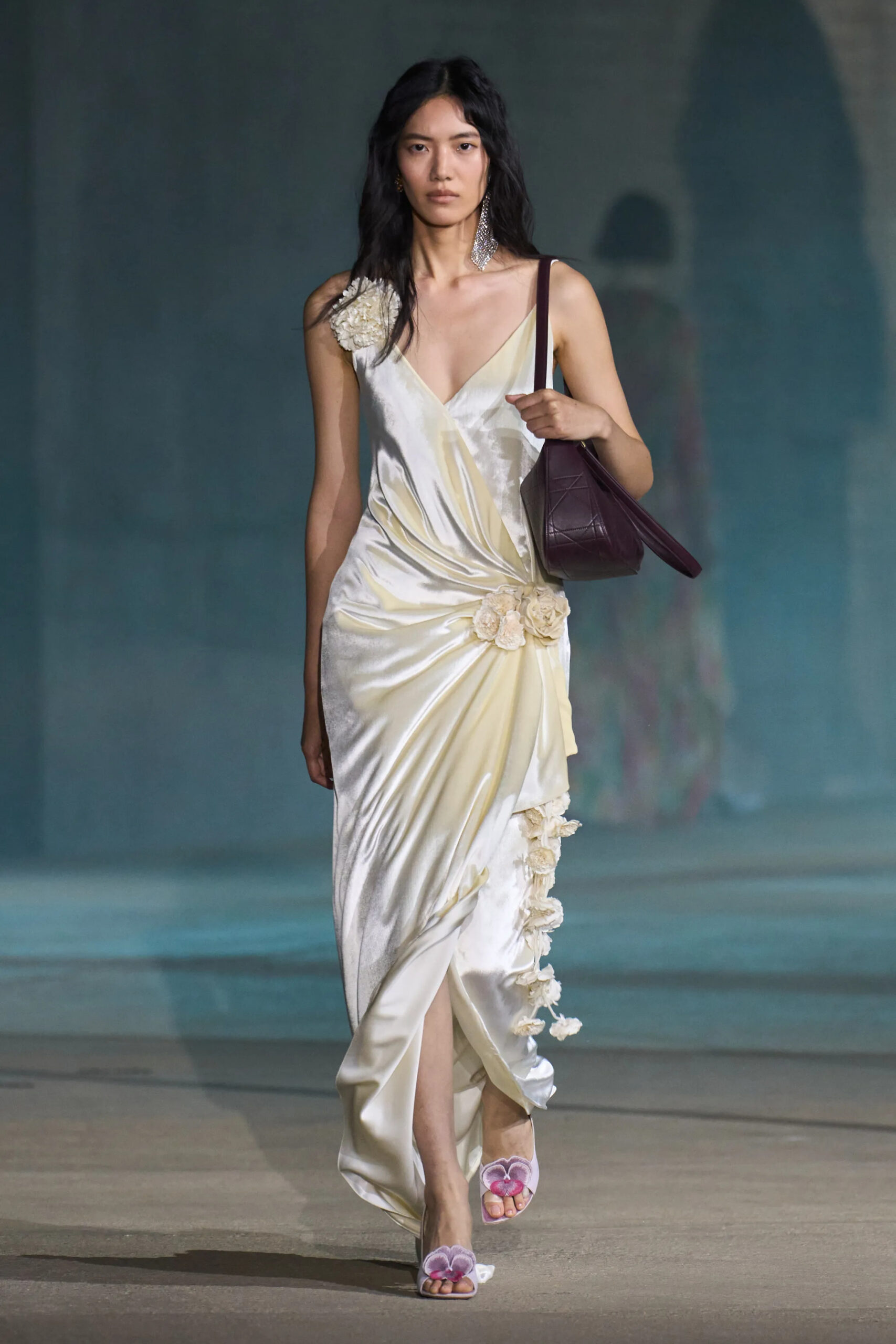 Christian Dior Resort 2027 ivory satin slip dress with burgundy handbag