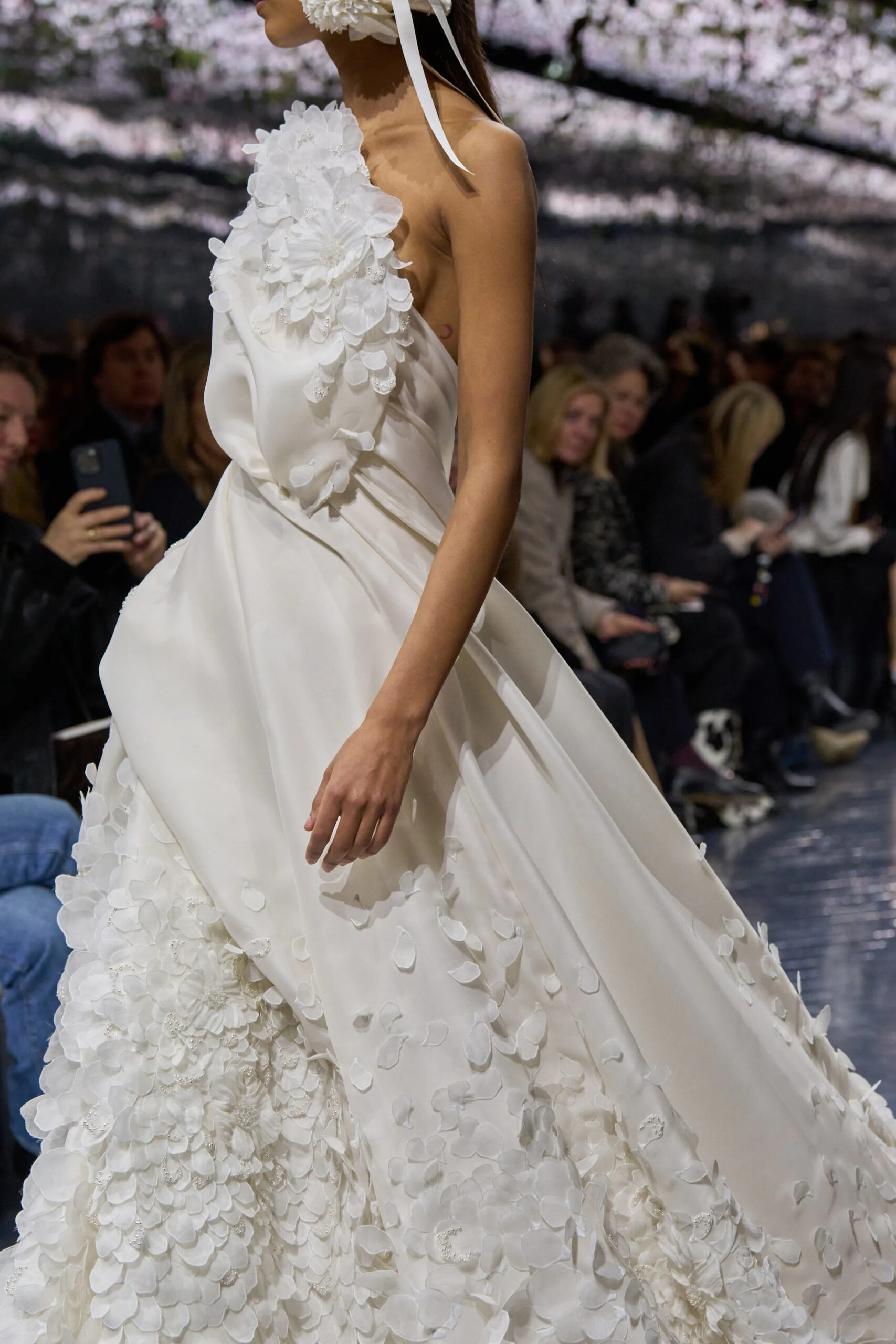 Close-up of ivory Dior couture gown with floral appliqué and draped fabric construction