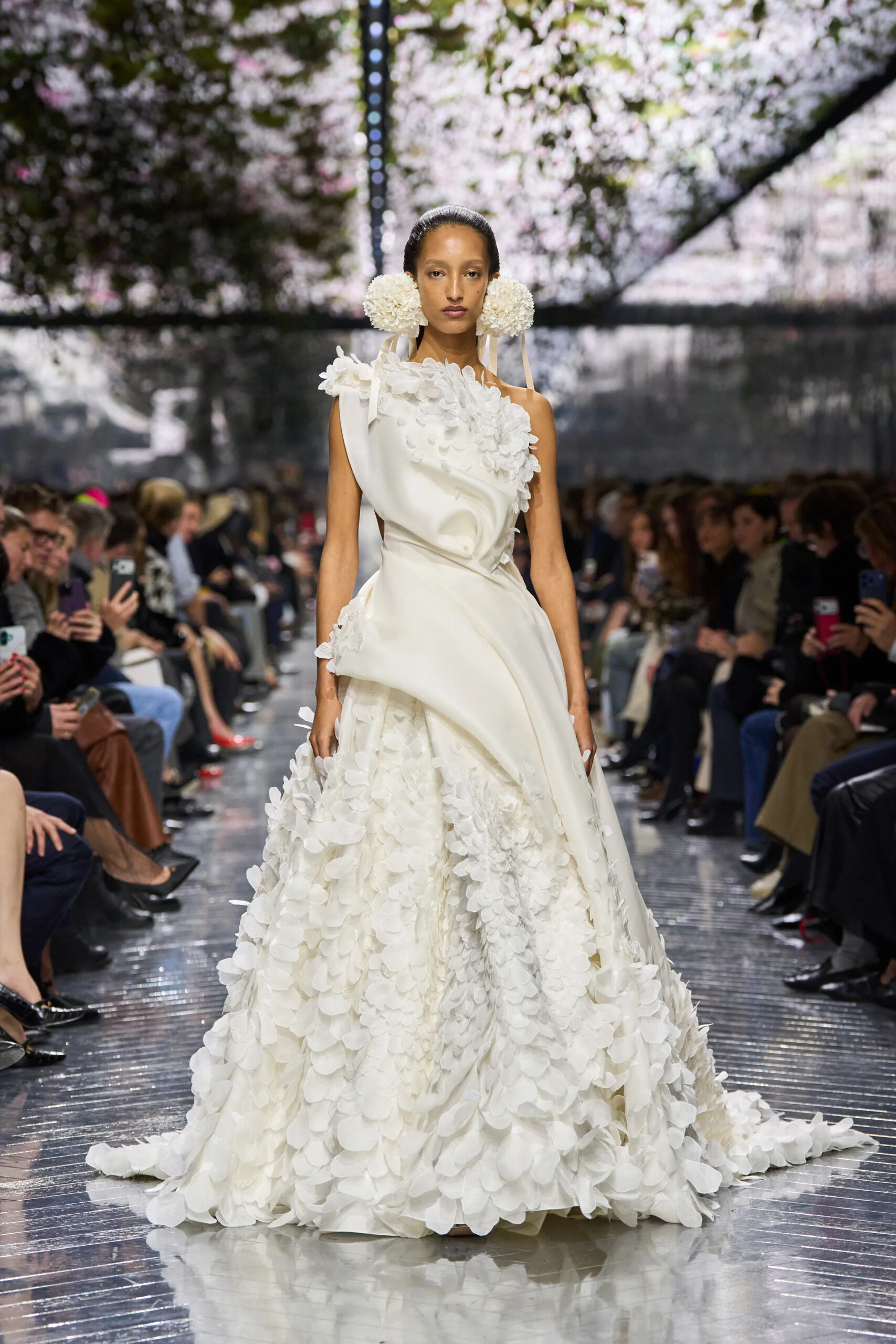 Close-up of ivory Dior couture gown with floral appliqué and draped fabric construction