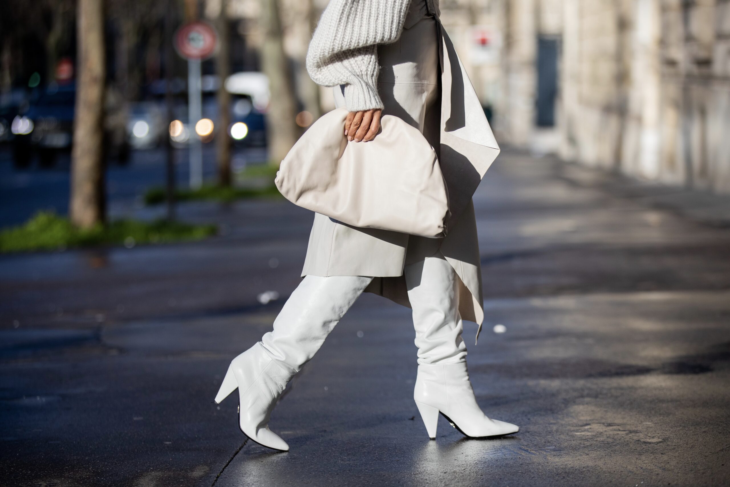 Details of leather Isabel Marant skirt and leather Prada boots during Paris Fashion Week.