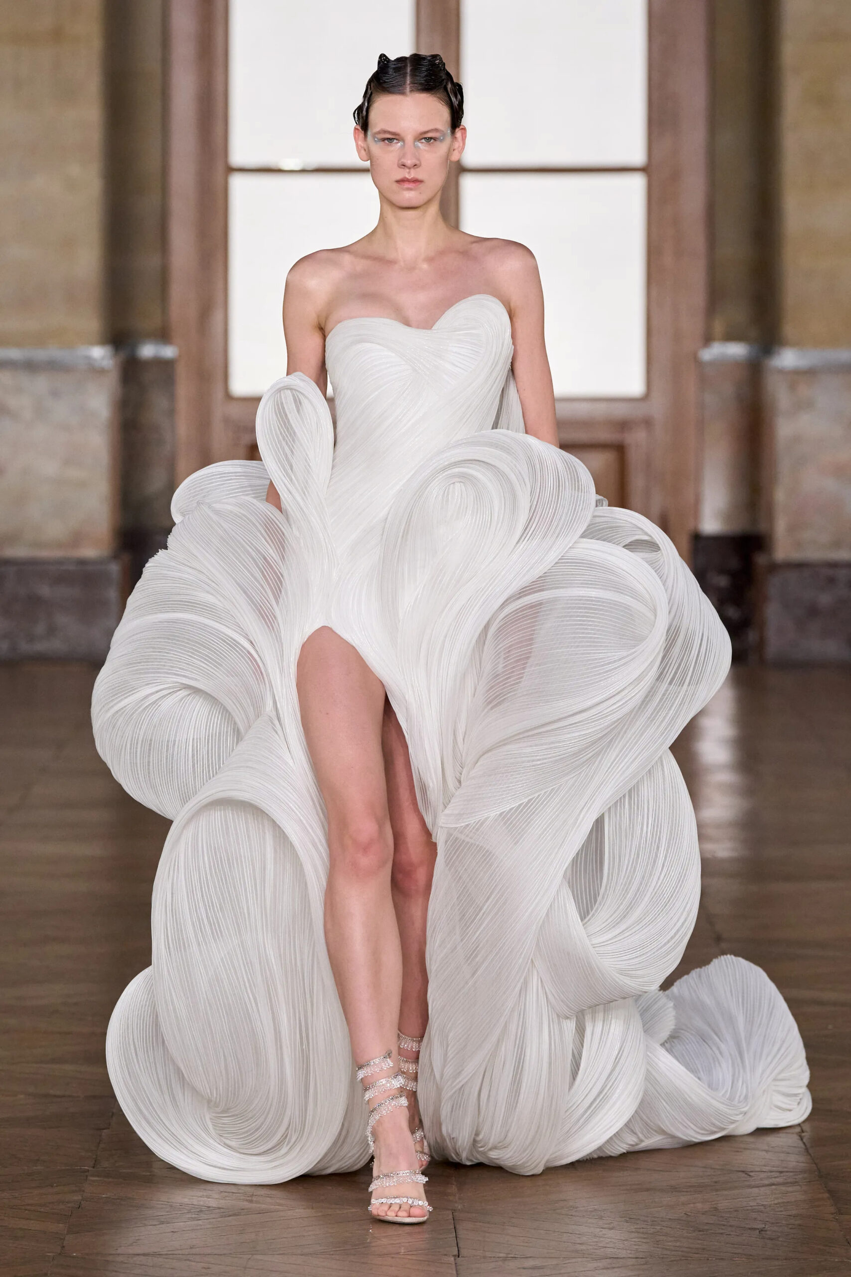 White sculptural pleated couture gown with dramatic ribbon-like construction from Gaurav Gupta Spring 2026 Couture