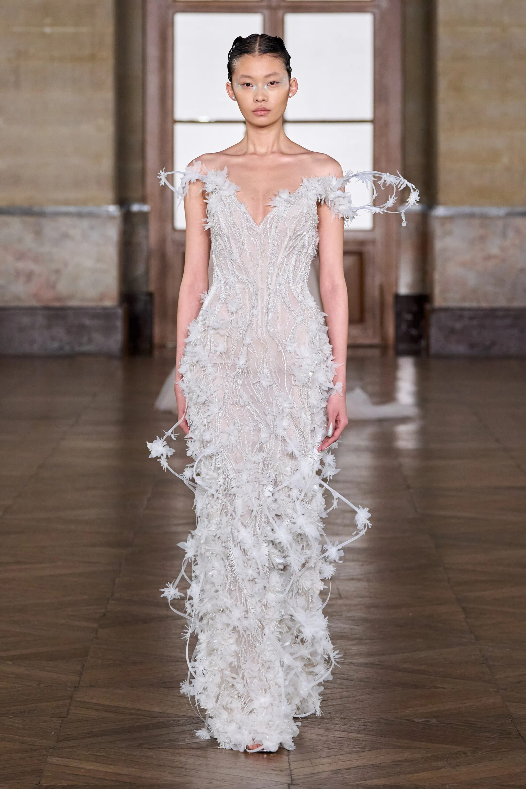 Sheer white feather embroidered couture gown with floral detailing by Gaurav Gupta Spring 2026 Couture