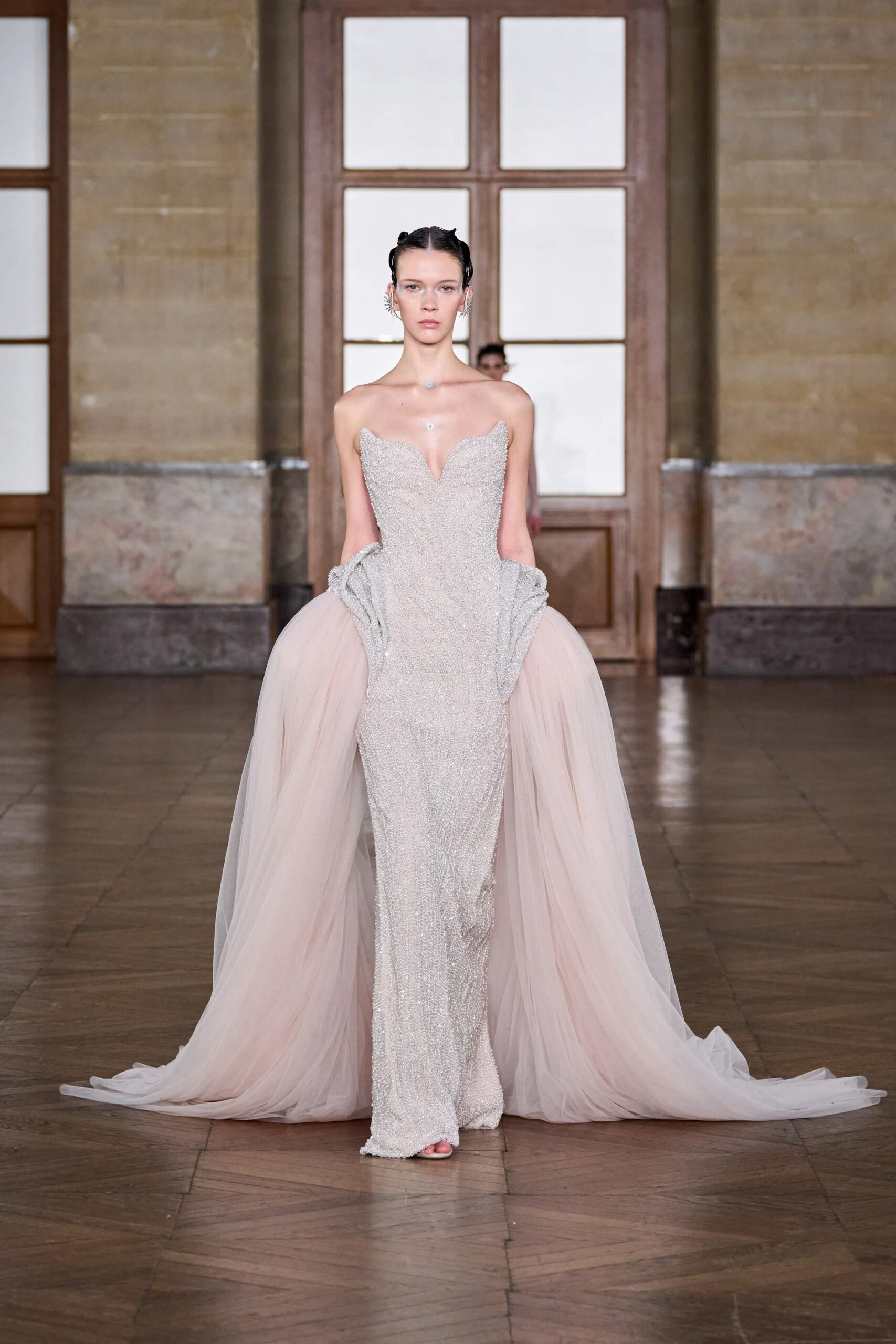 Crystal embellished couture gown with blush tulle side drapes from Gaurav Gupta Spring 2026 Couture