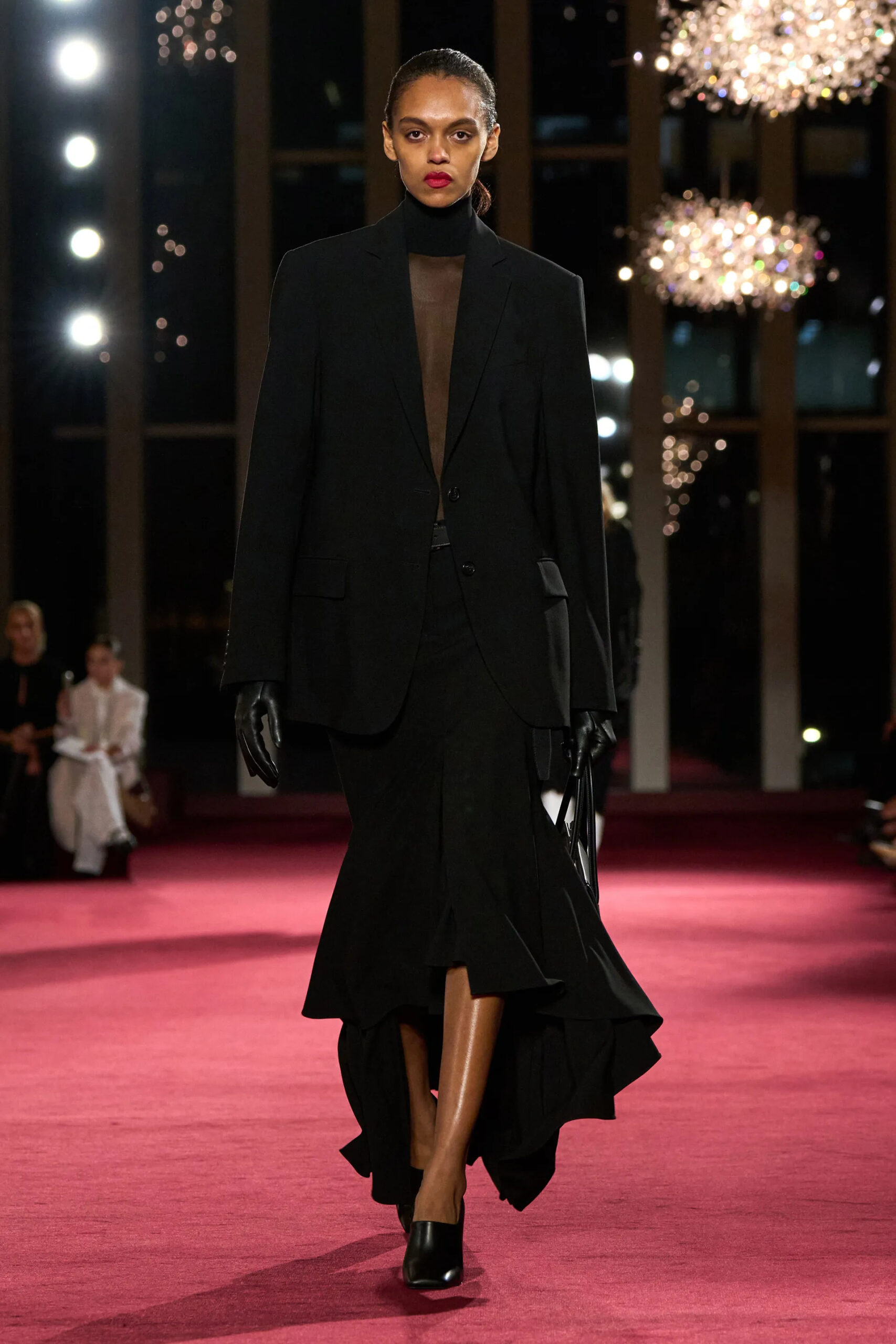 Michael Kors Collection black tailored sheer runway look during Fall Winter 2026 New York Fashion Week