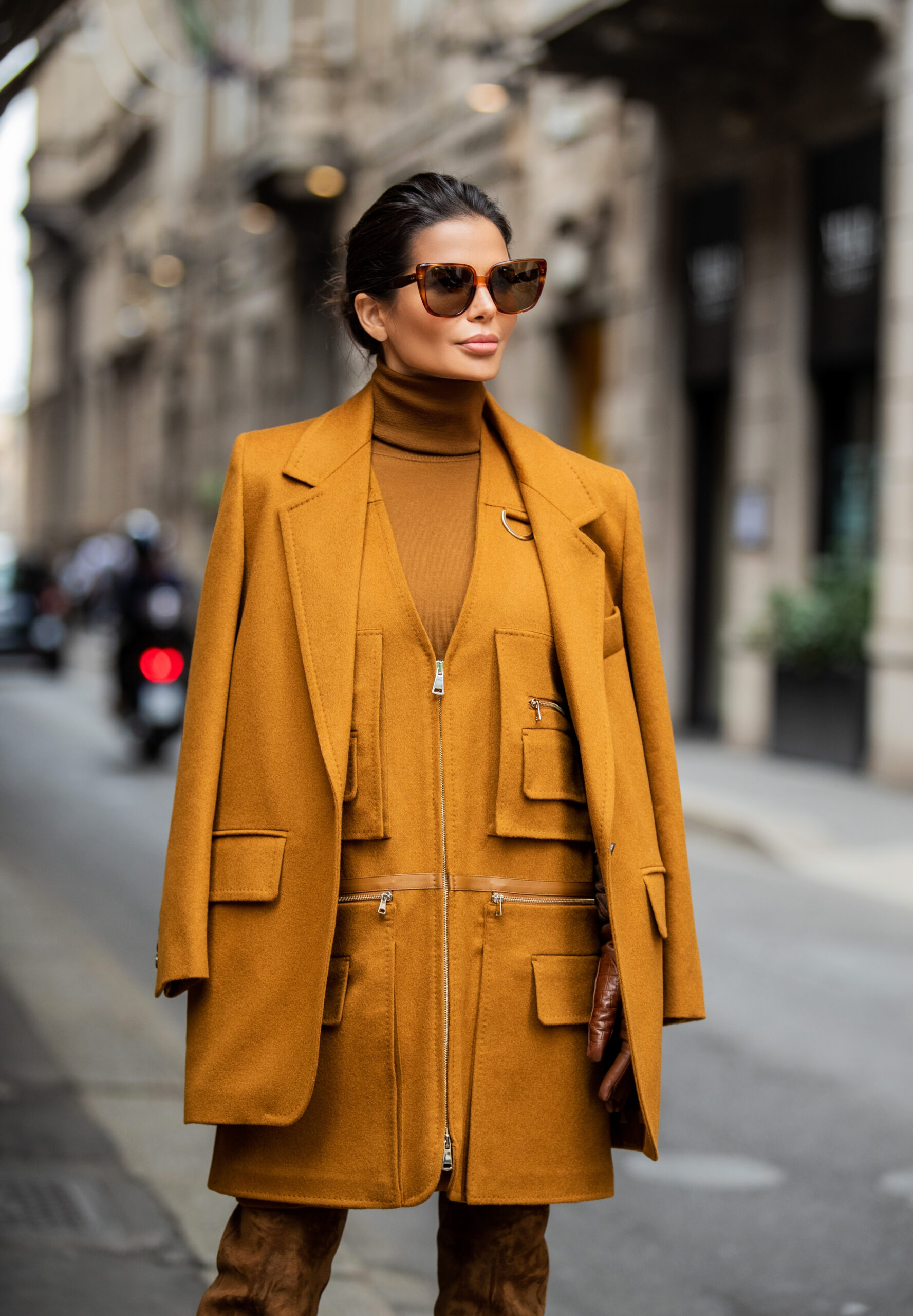 Close-up portrait of Victoria Barbara wearing a Max Mara blazer, vest and skirt with Celine sunglasses during Milan Fashion Week.