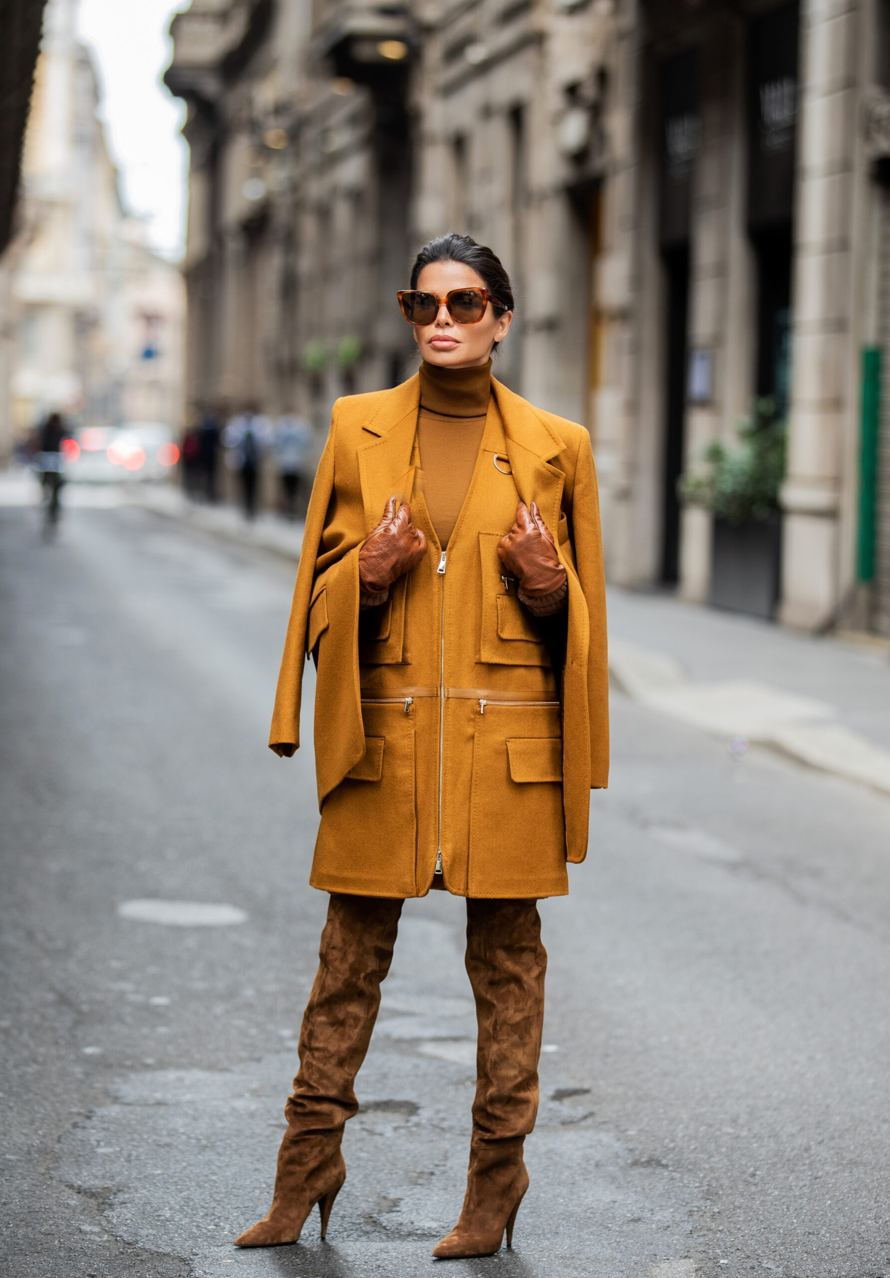 Victoria Barbara photographed in Milan wearing a tobacco-colored Max Mara ensemble with leather gloves and Celine sunglasses.