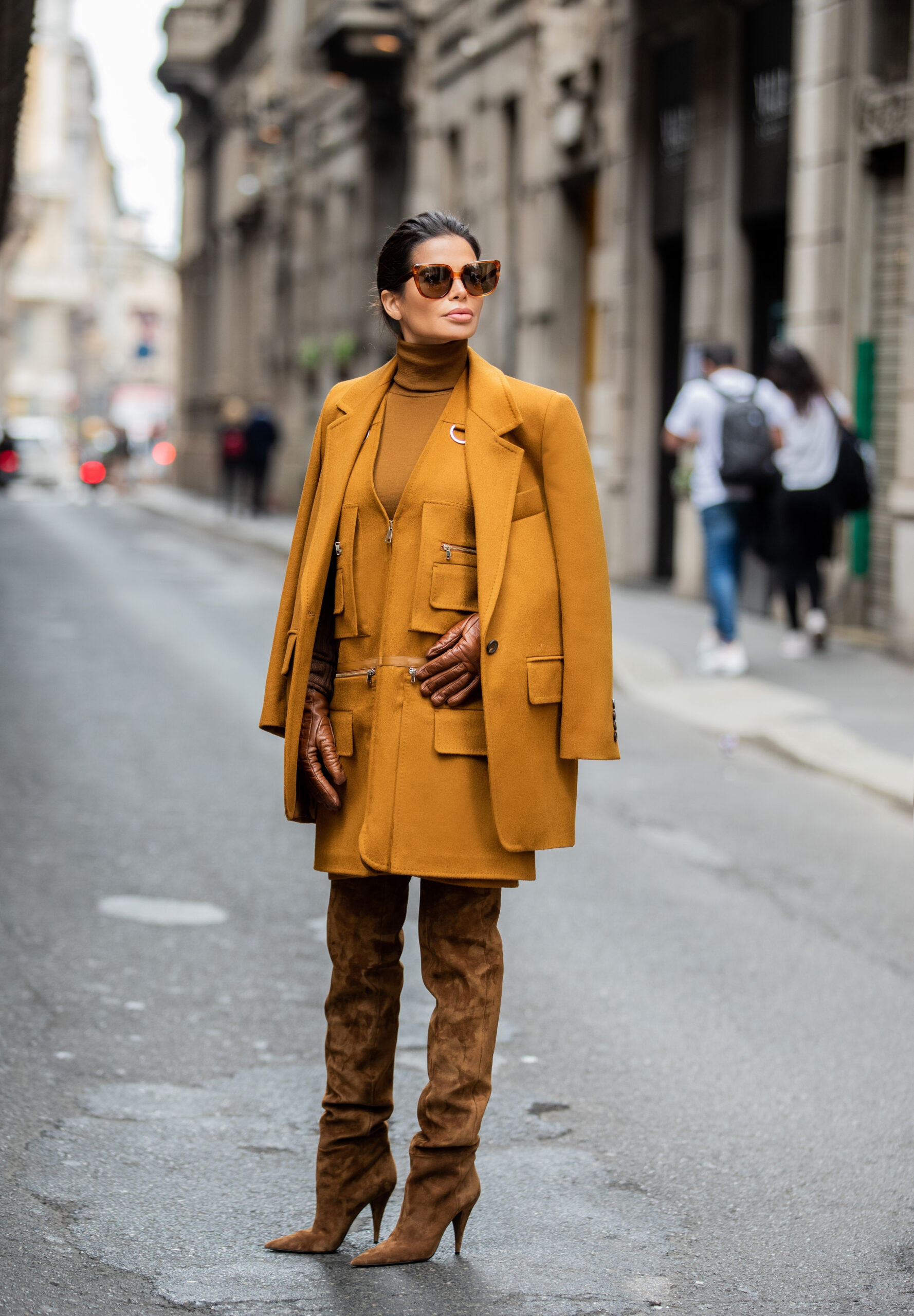 Street style portrait of Victoria Barbara during Milan Fashion Week wearing Max Mara tailoring and Saint Laurent boots.