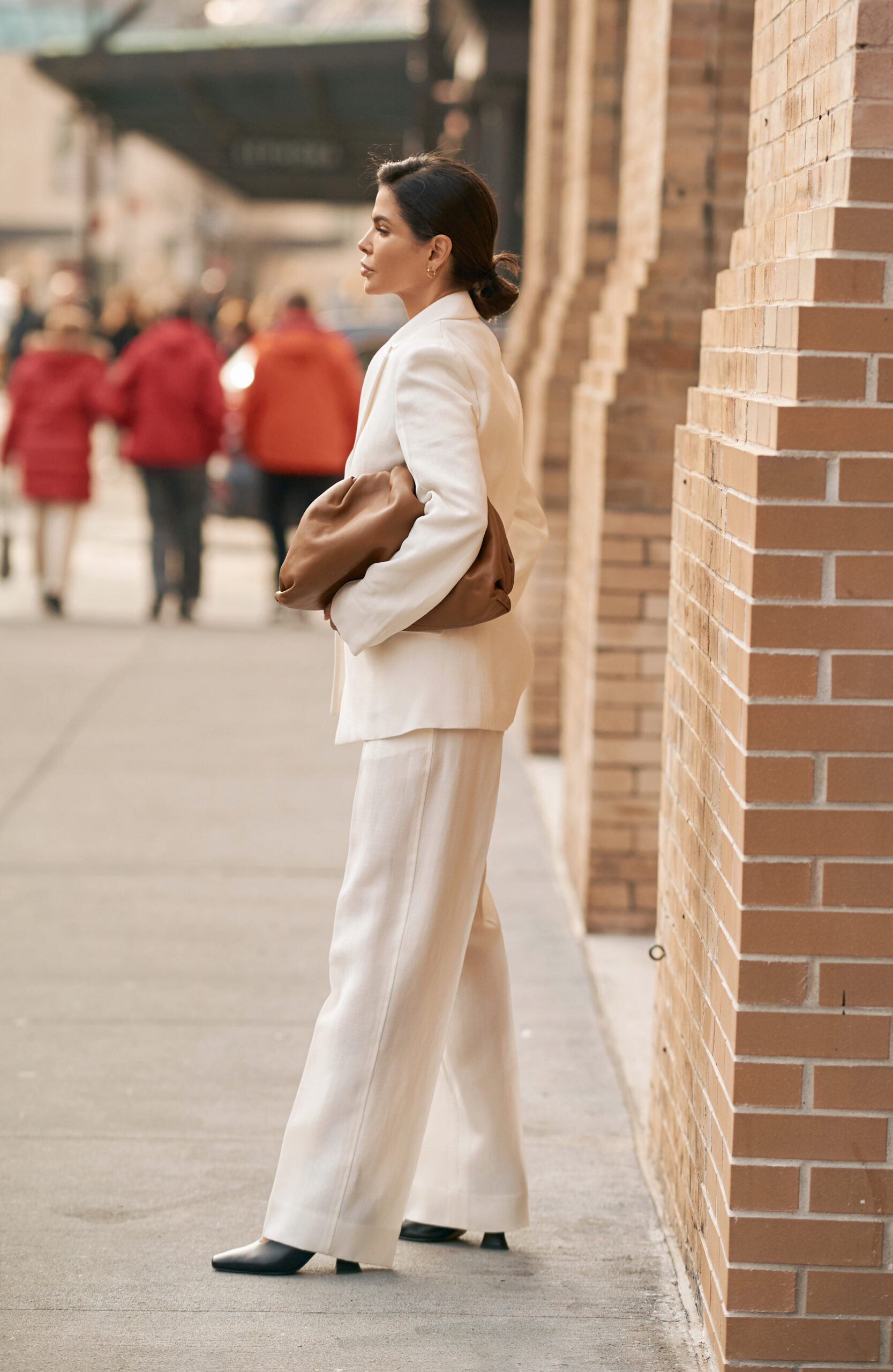 Victoria Barbara wearing an ivory Jil Sander suit with Celine sunglasses and Bottega Veneta accessories in New York.