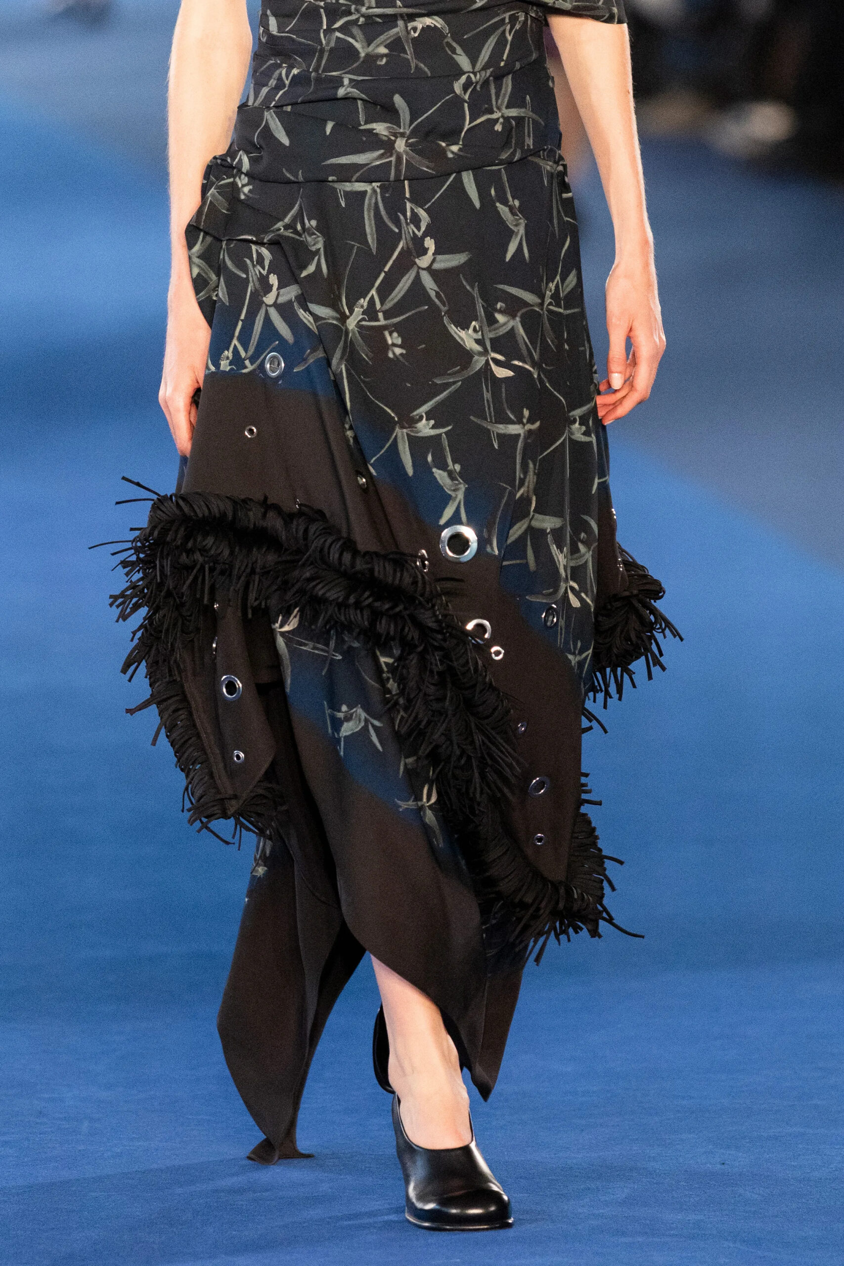 Black printed fabric with fringe and grommet details from Proenza Schouler Fall 2026
