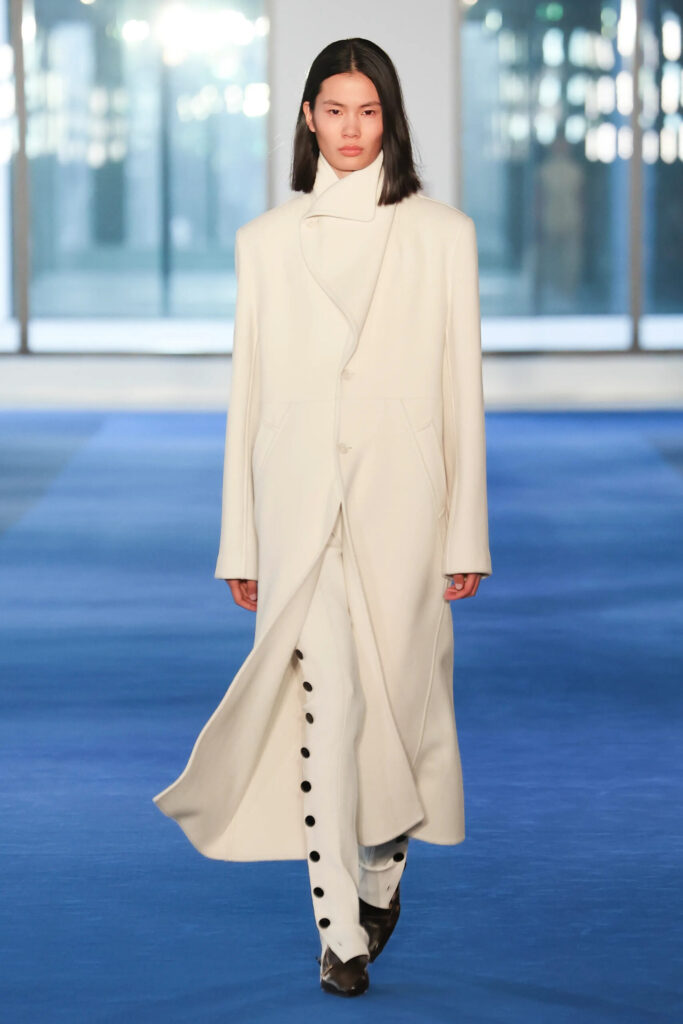Ivory tailored coat with button-detail trousers from Proenza Schouler Fall 2026 by Rachel Scott